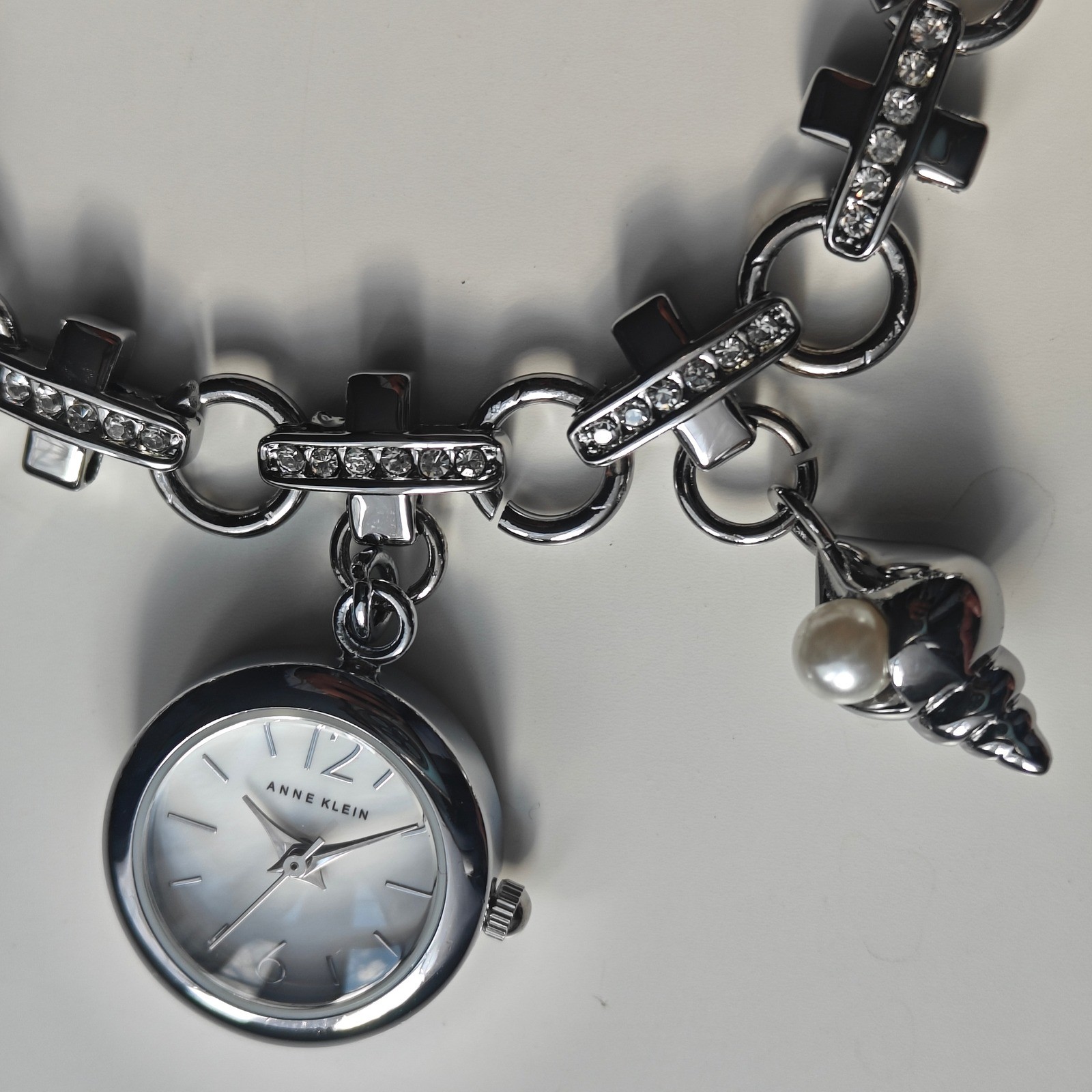 Anne Klein Silver Tone Beachy Charm Bracelet Watch Dolphin Starfish Seashell