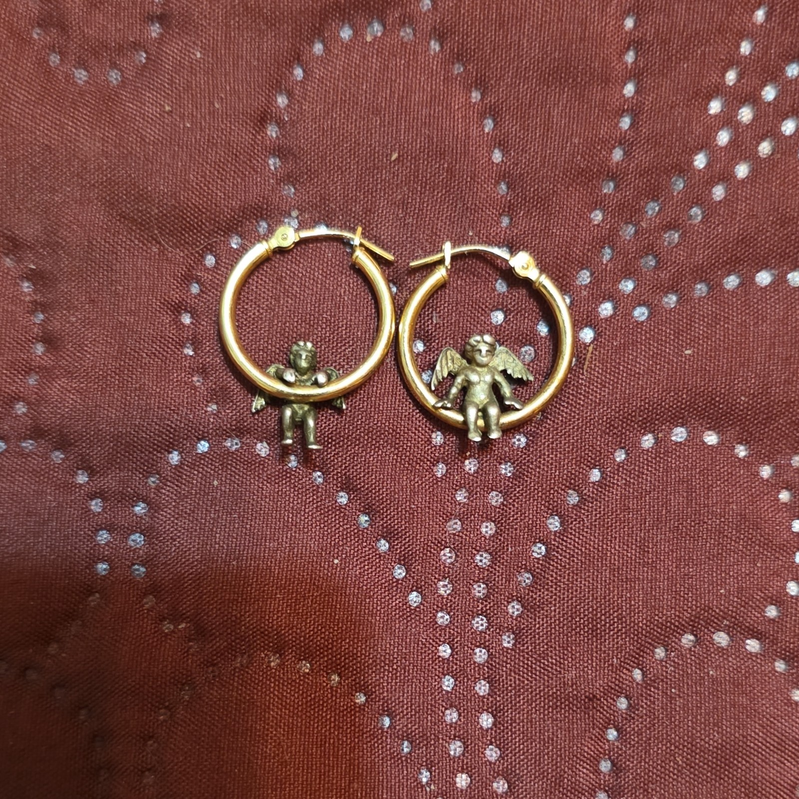 These earrings are vintage Jacmel JCM 14K yellow gold hoops with sterling angels