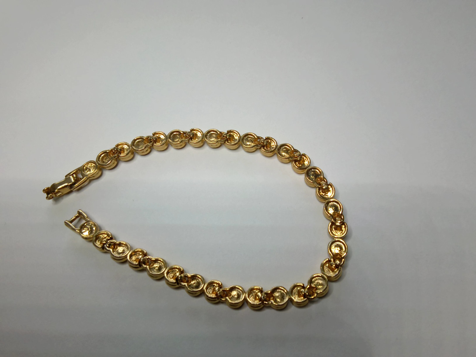 Gold Tone Tennis Bracelet with Alternating Clear and Purple Rhinestoness