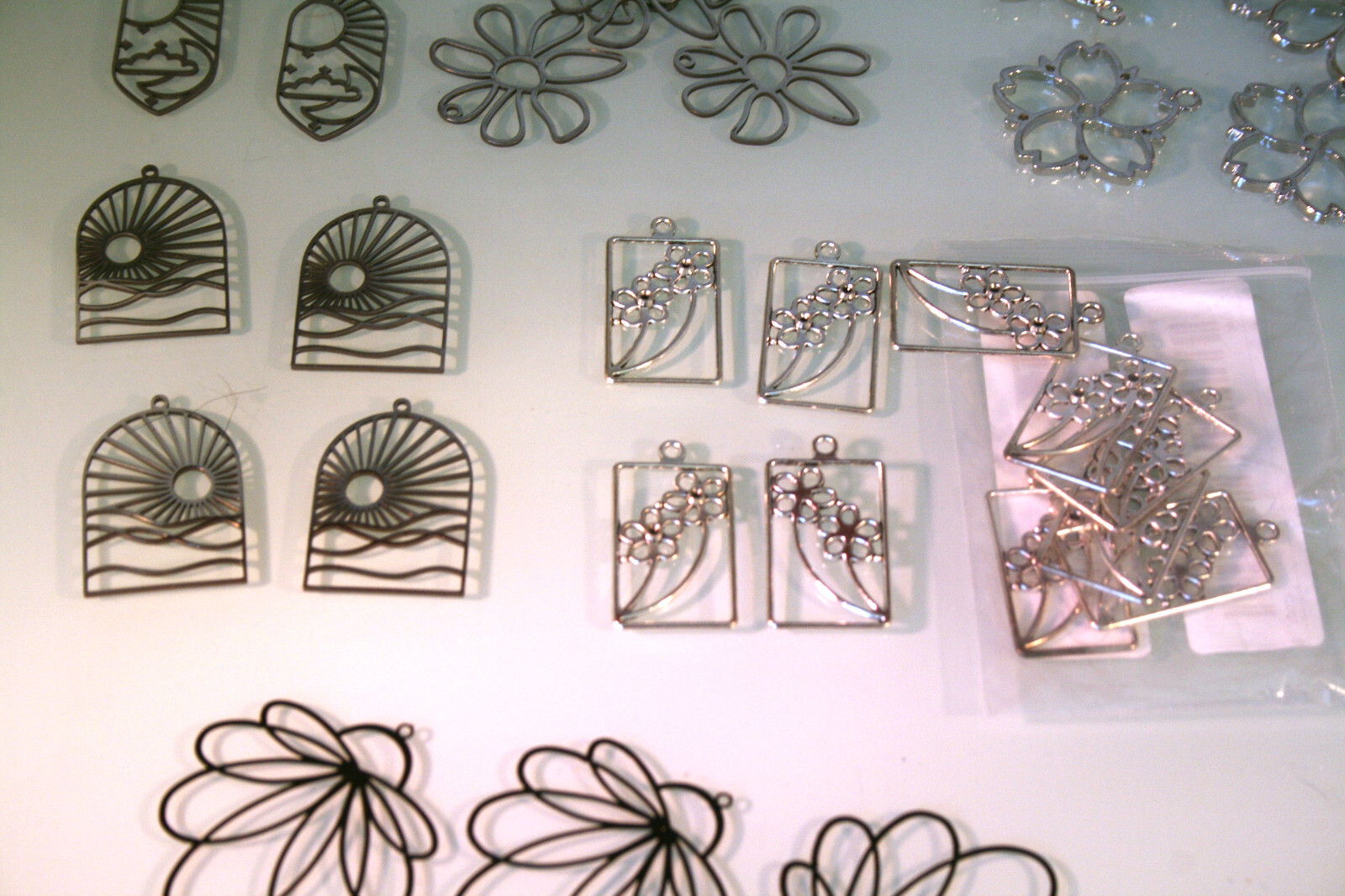 Stainless steel hollow style earring bases, various designs 43 total pieces