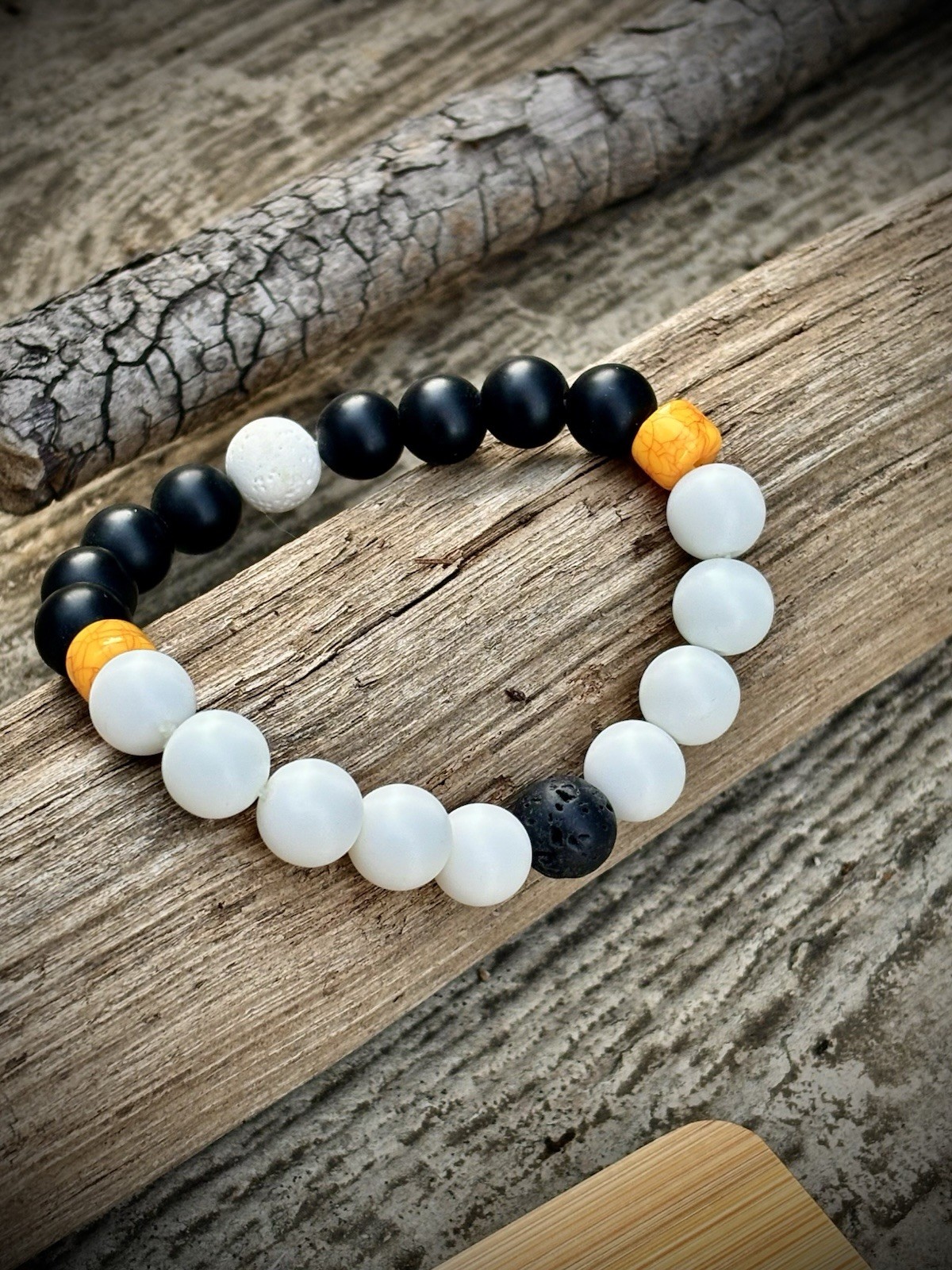Bracelet with matte black/ white onyx, lava stone and yellow bohemian.