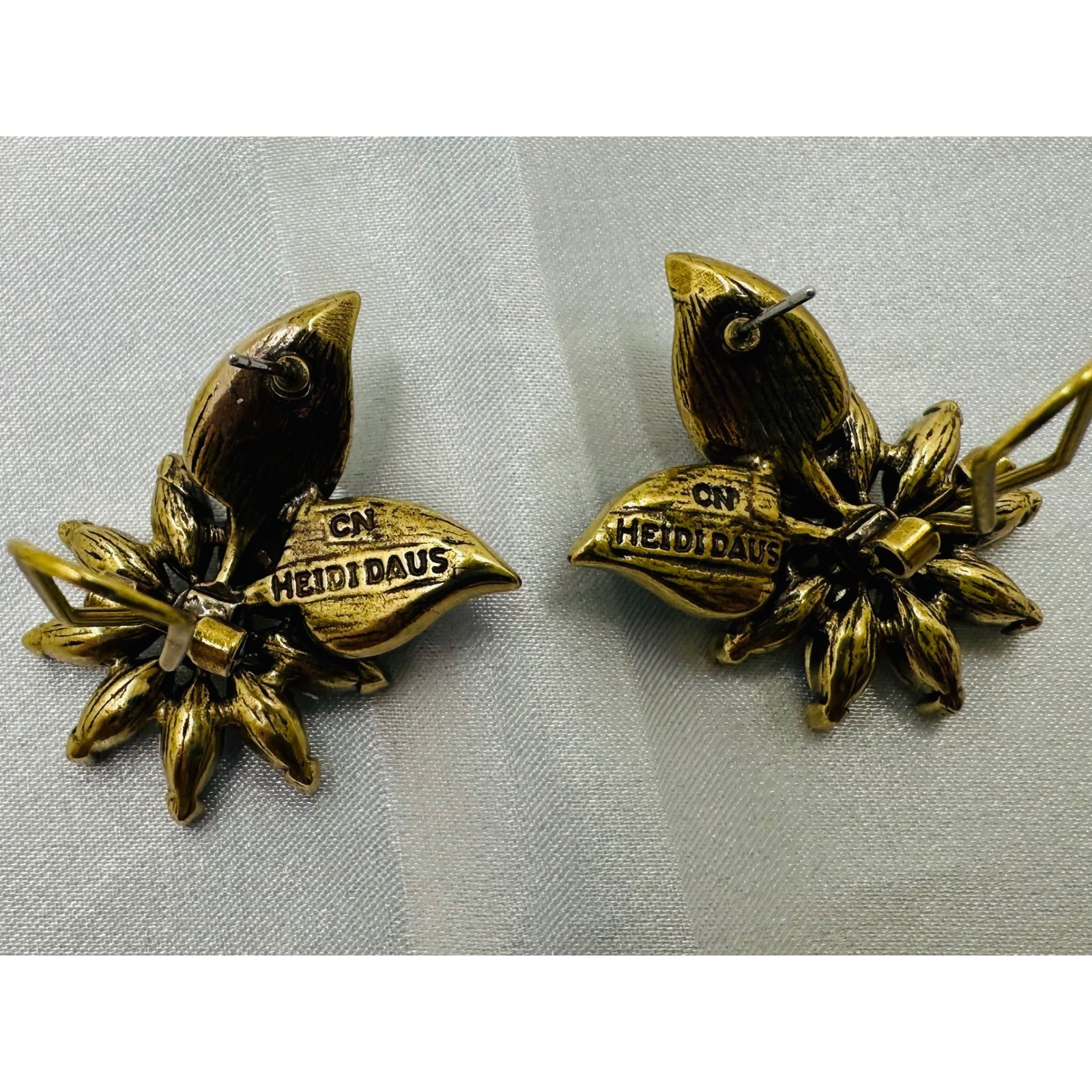 Heidi Daus Crystal Daisy Flower Omega Back Earrings Bronze Tone Green Yellow