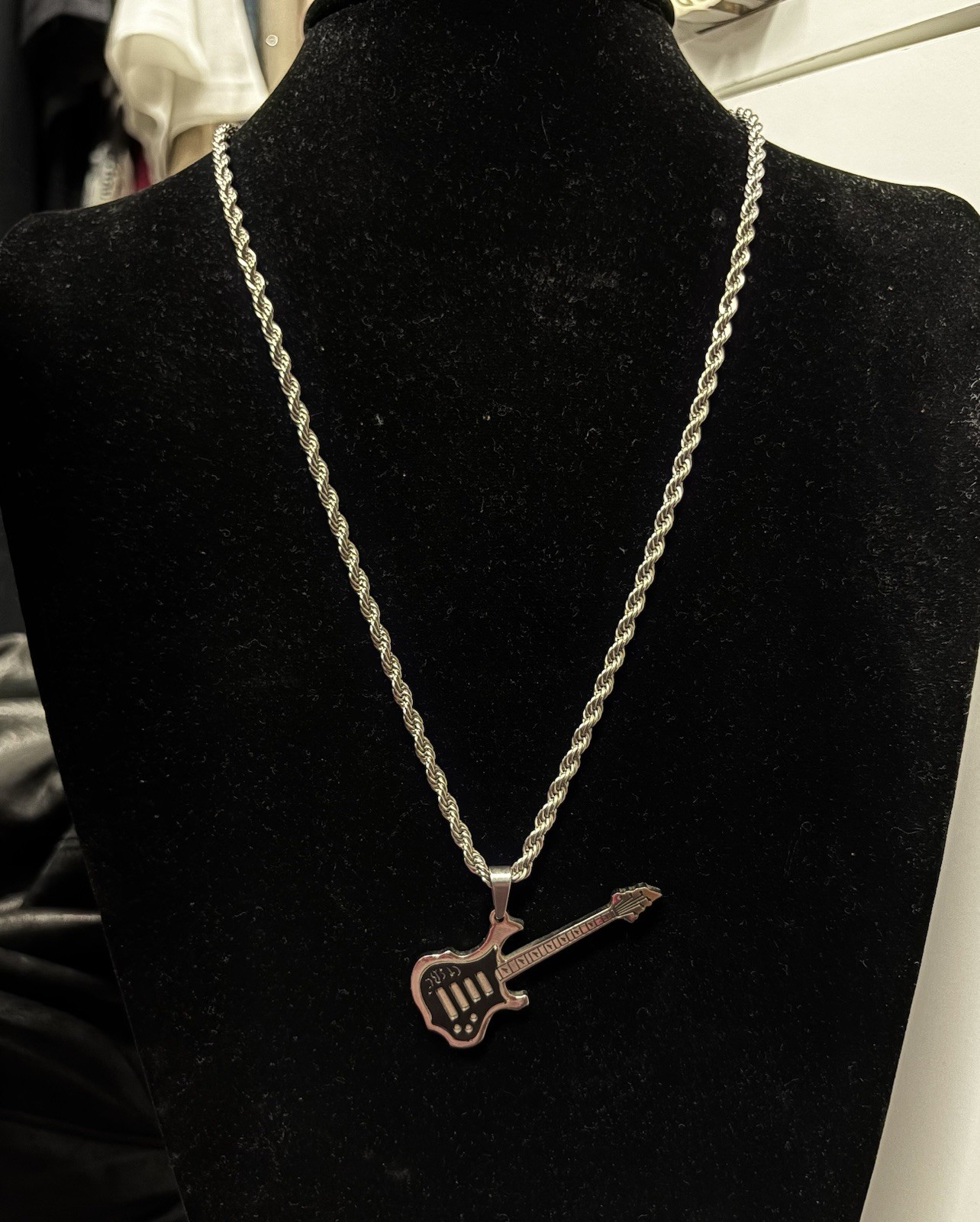 stainless steel guitar pendant necklace features electric guitar silhouette