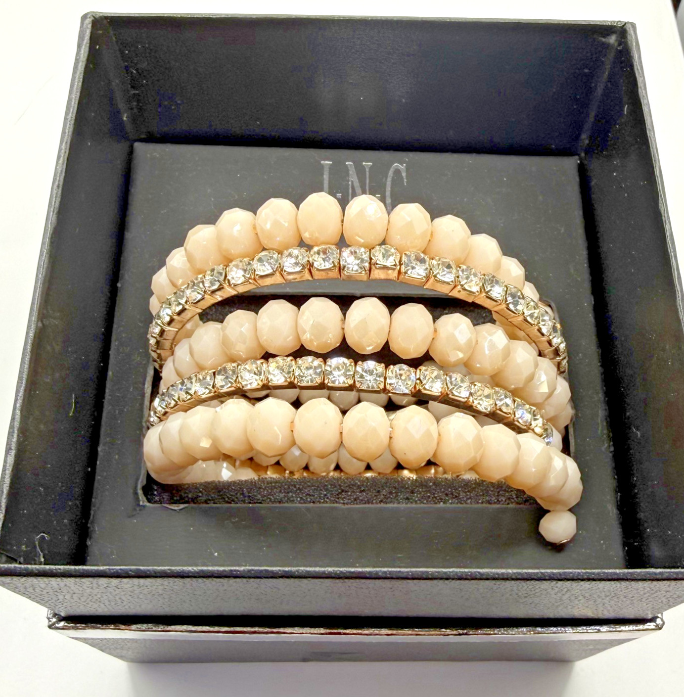 5 row crystal and gemstone coil layered bracelet 1 stone missing INC in box