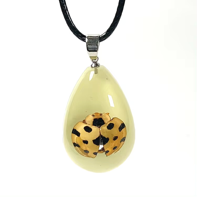 Glow in the dark bug necklaces in resin