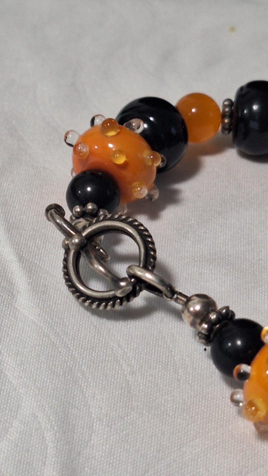 Black/Orange Glass Beaded Bracelet, Silver Tone Toggle Clasp, Dangle Charm