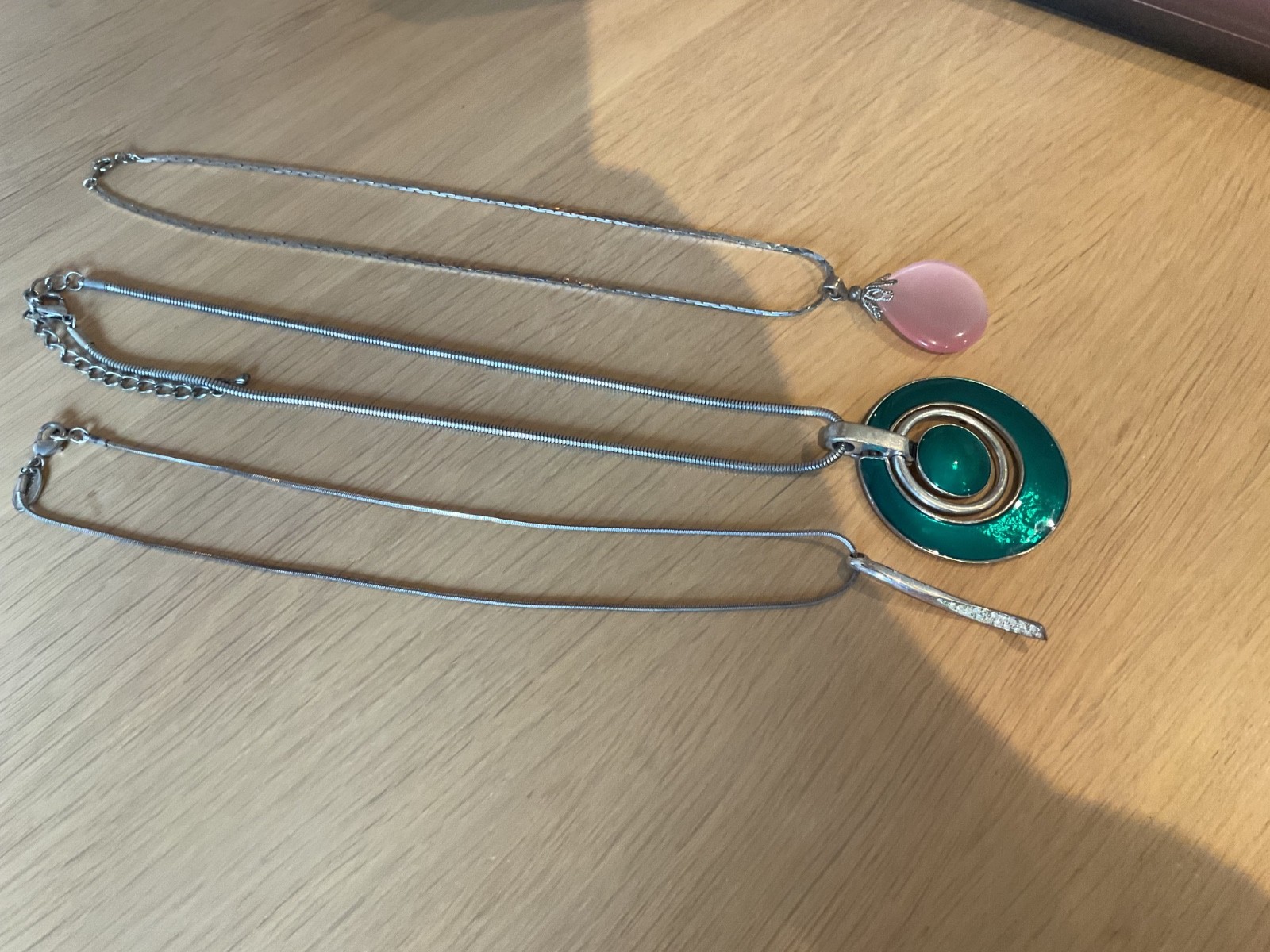 NEXT SILVER TONE PENDANT WITH STONES &2 OTHER PENDANTS GREEN & PINK STONES