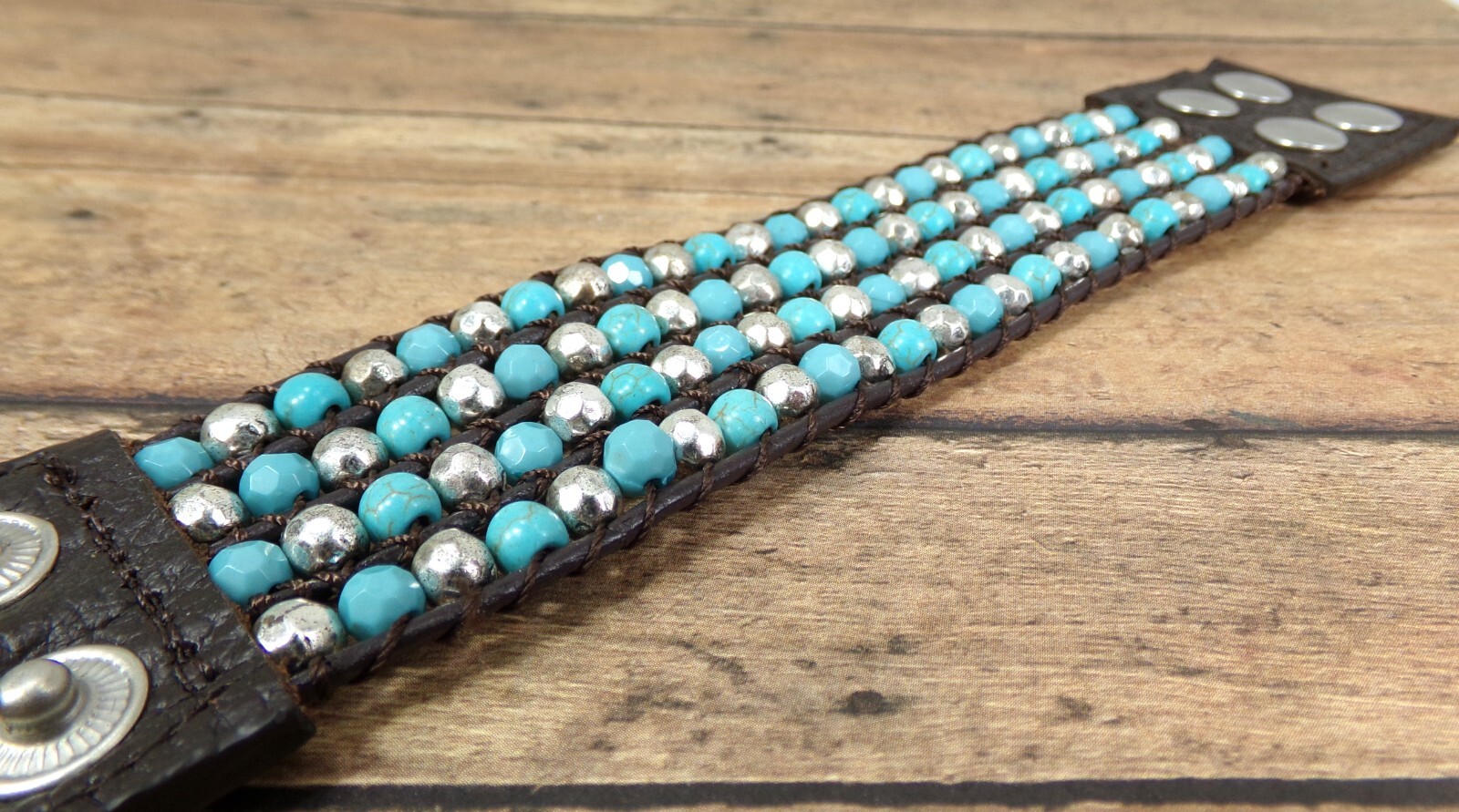 Wide turquoise and silver beaded leather bracelet , snap closure, brown leather