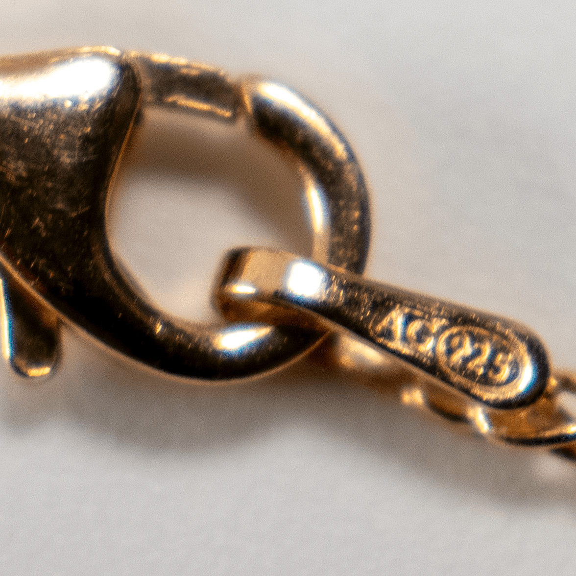 Finely braided silver necklace with gold-plated rose gold