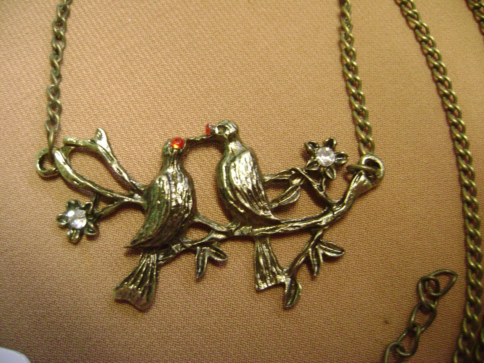 NWT- LOVE BIRDS, CRYSTAL FLOWERS BRANCH BRASS TONE 26″ LENTH NECKLACE