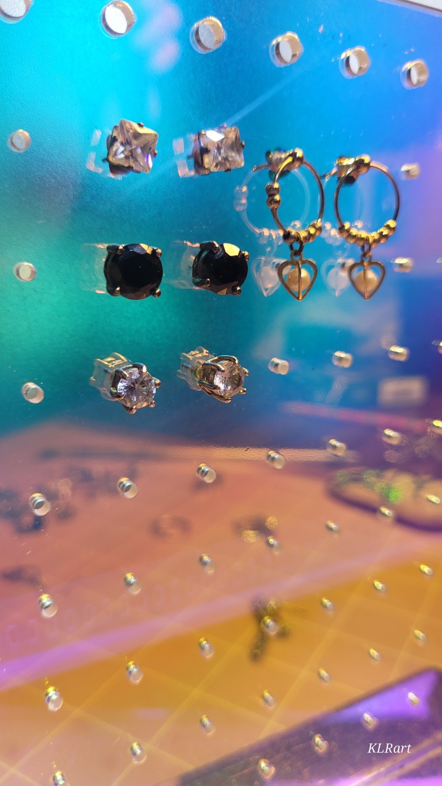 4 pair studs that do sparkle, gold plated pearls, large black Spinal studs