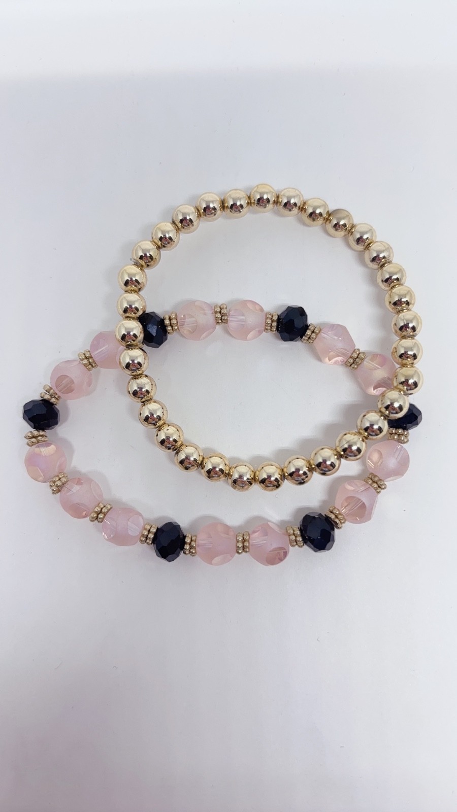 5 Piece Black, Pink, and Gold Bracelets with different Carves and Designs