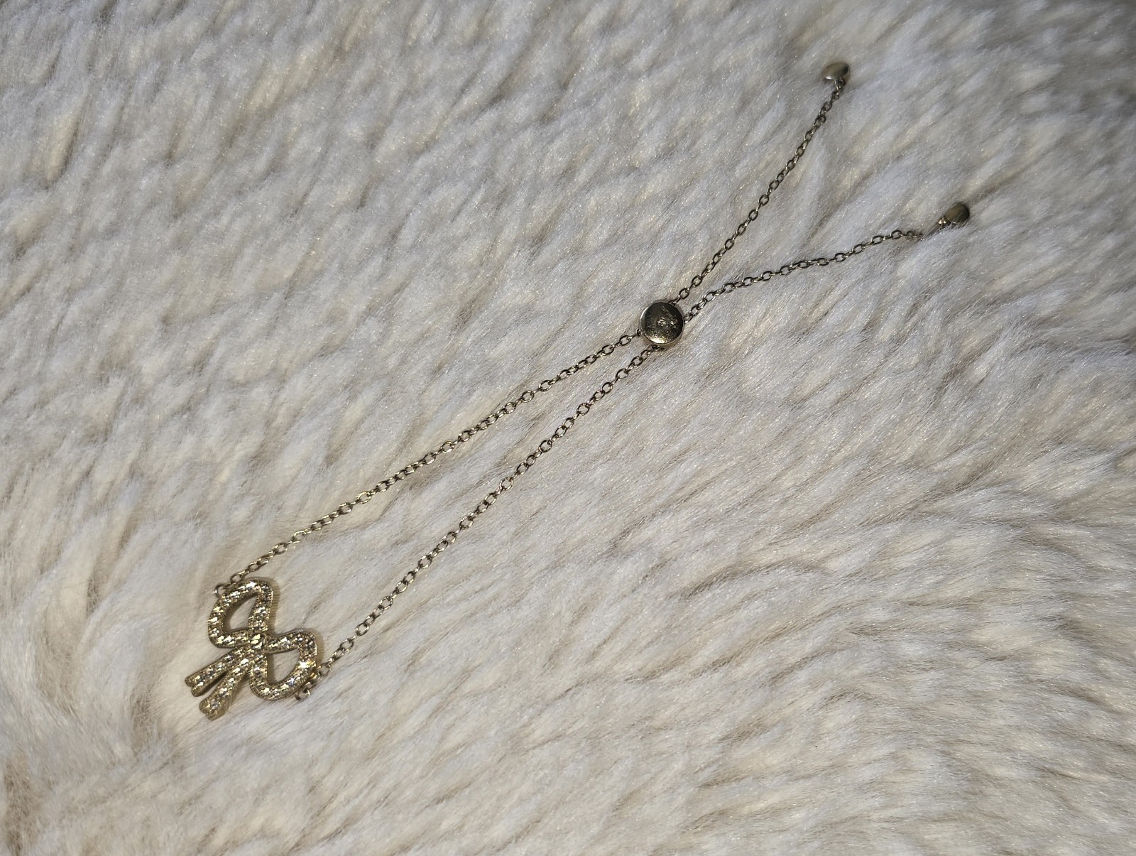 Coach New York Pave Bow Slider Bracelet Gold toned Clear Crystals
