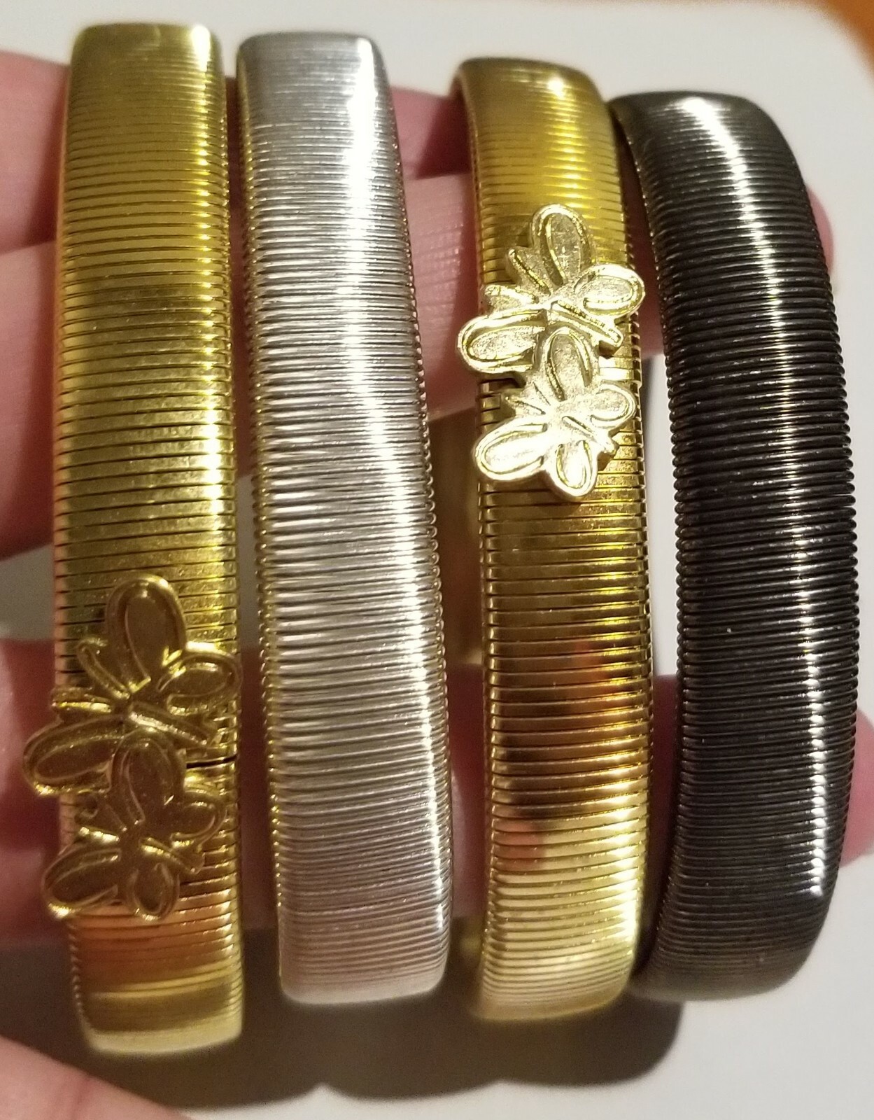 **Banglemania 4 Flexible Bracelets 2 Gold Tone 1 Silver 1 Gun Metal**
