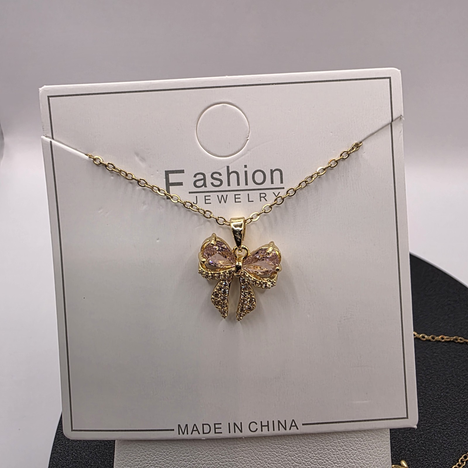 Stainless Steel Copper Plated 16″Necklace w/16mm Cz Bow Pendant