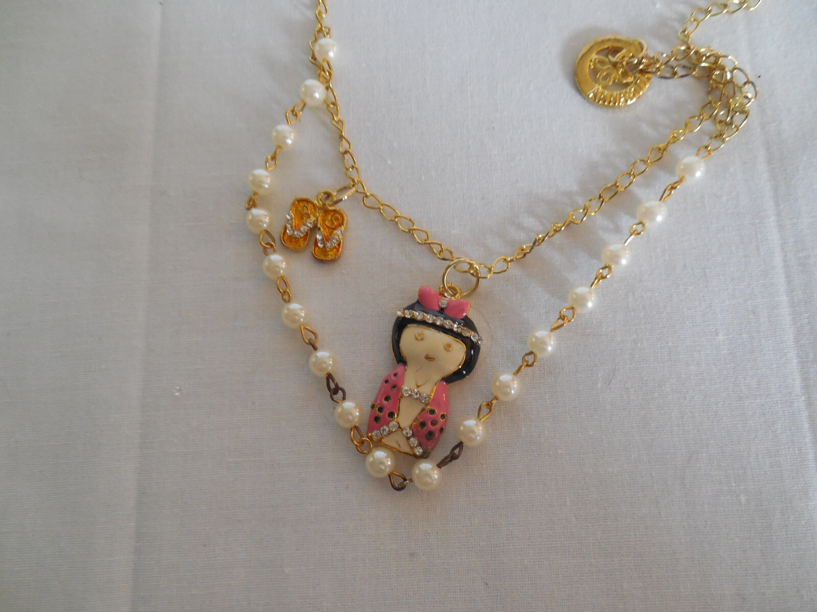 Anna Sui gold tone enamel w/rhinestones girl pendant necklace NWT