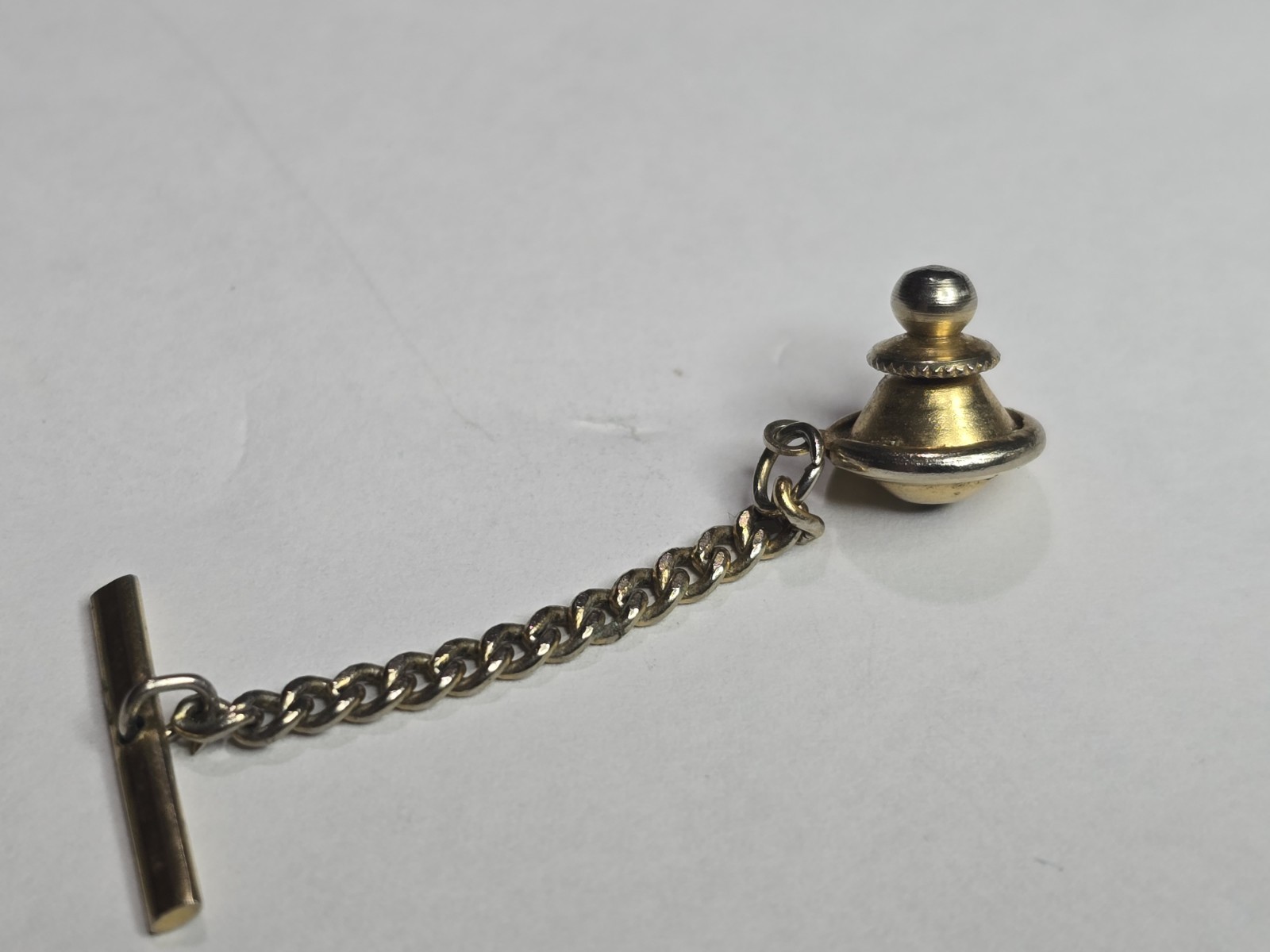 Gold Toned Tie Pin Backing With Chain