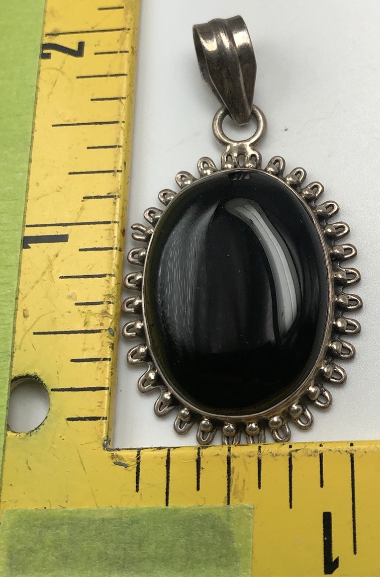 Black Onxy Oval Cabochon Pendant Bezel Set In Sterling Silver