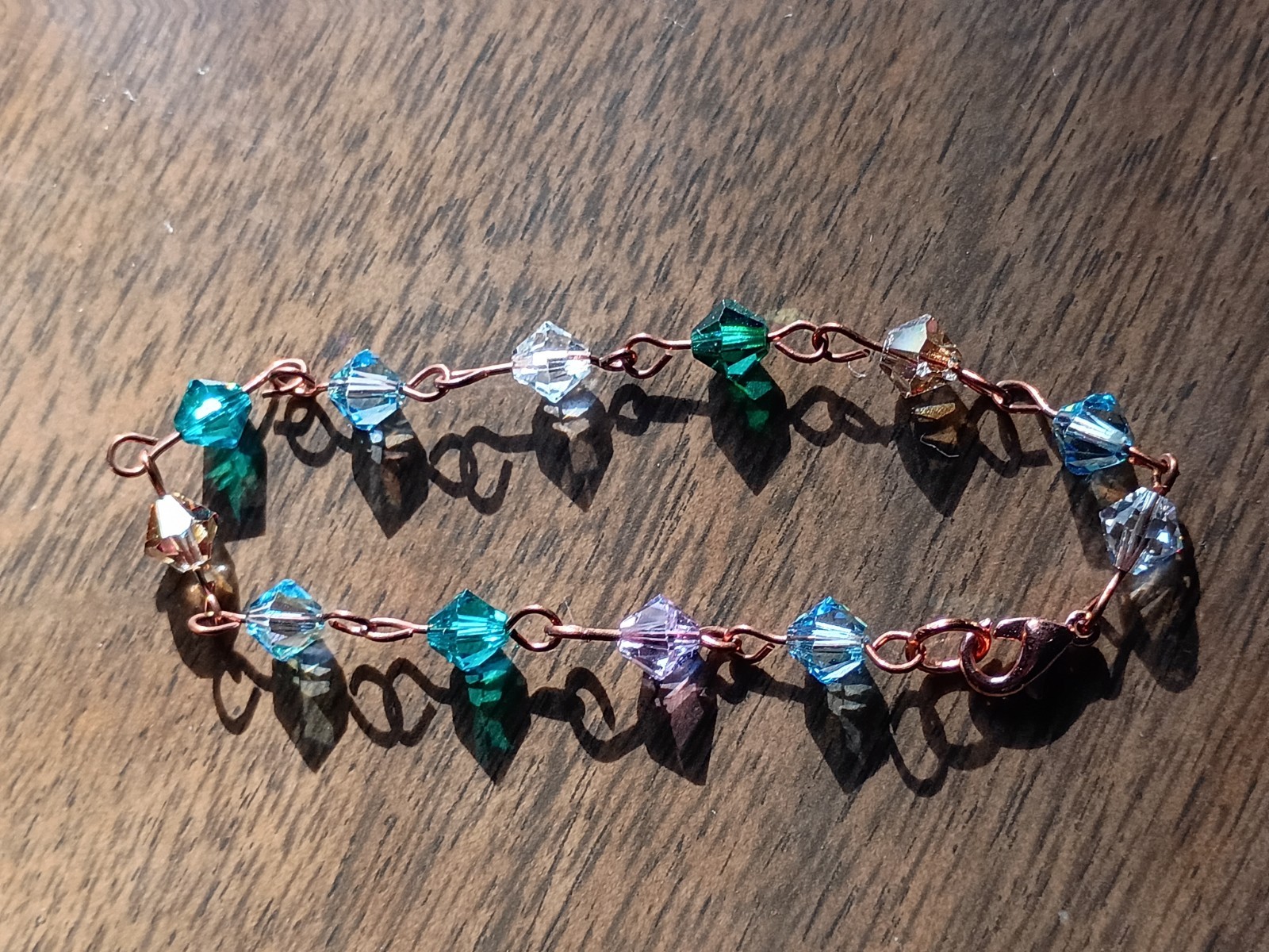 Green And Blue Crystal Beaded Bracelet made with copper eye pins.