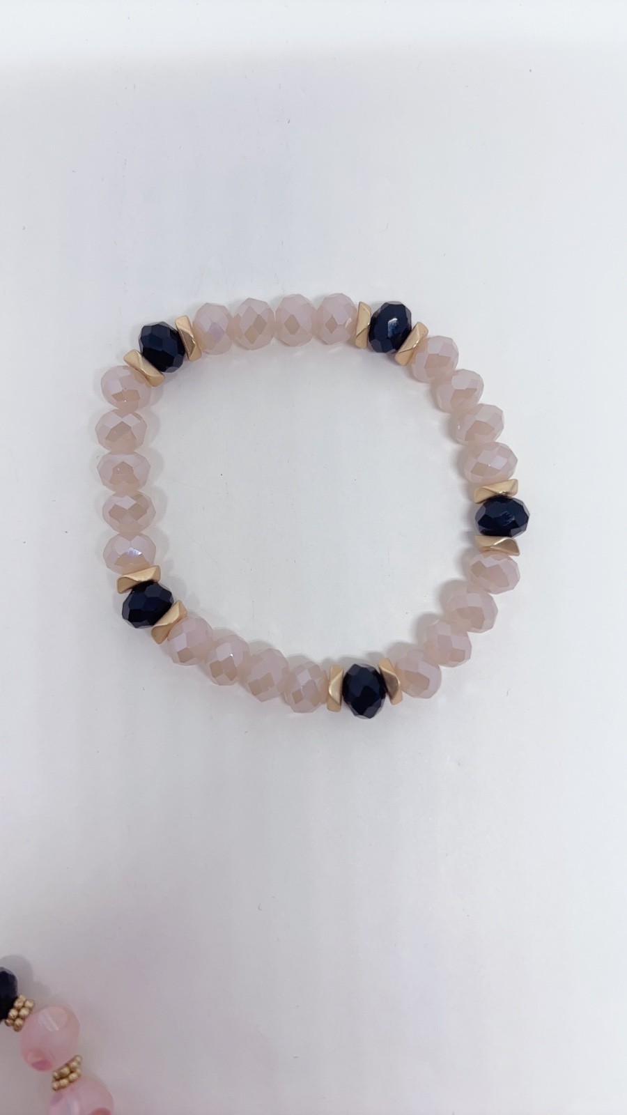5 Piece Black, Pink, and Gold Bracelets with different Carves and Designs
