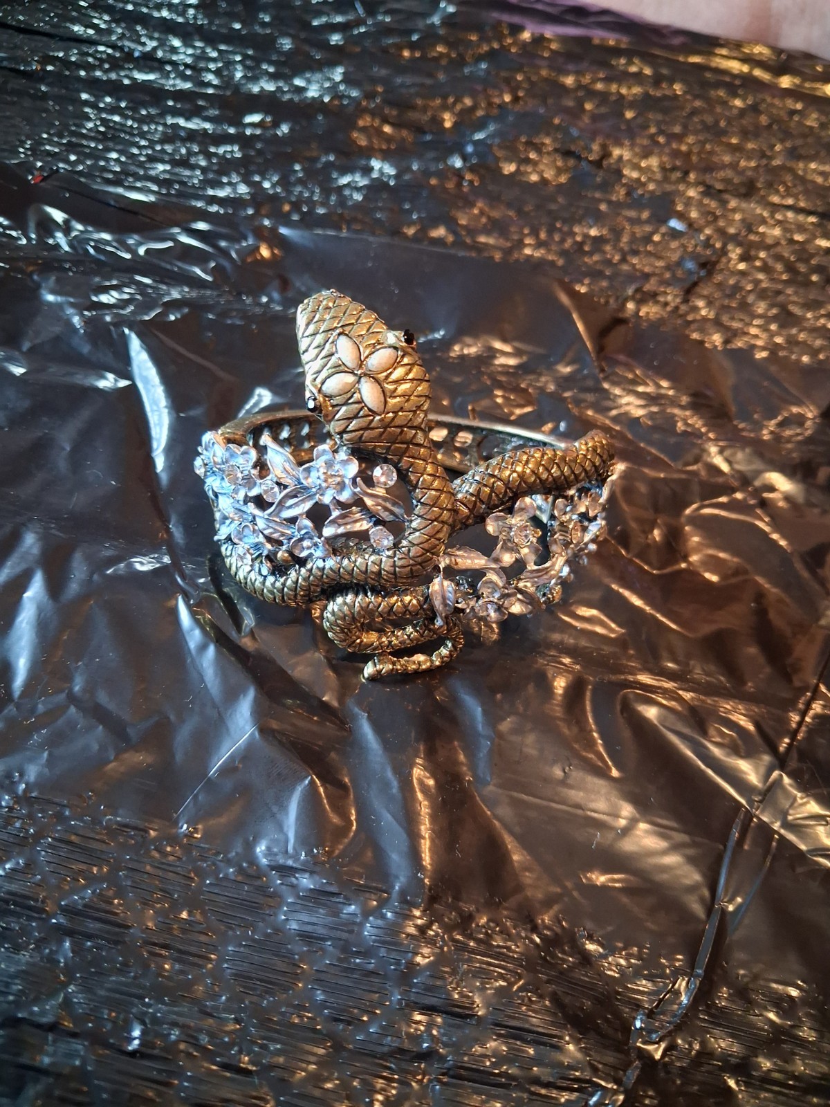 Coiled snake hinge cuffed bracelet