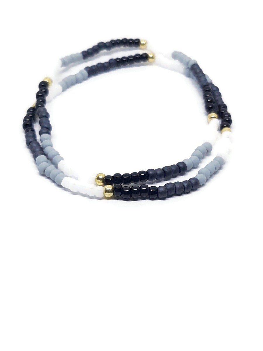 White, gray, black and gold stretch cord color block bracelets. Set of 2