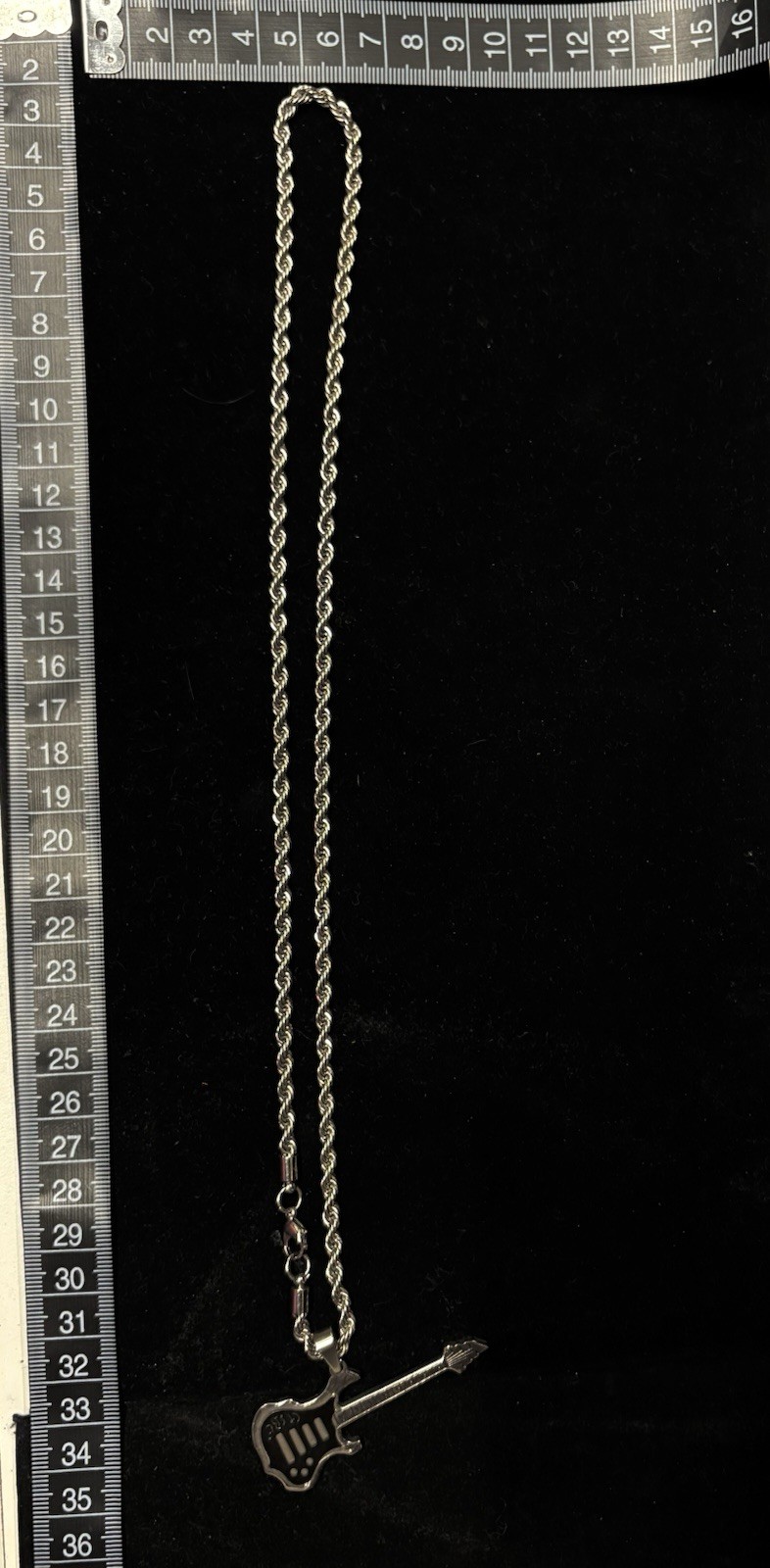 stainless steel guitar pendant necklace features electric guitar silhouette