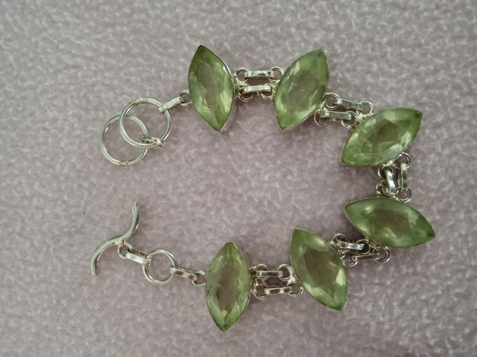 7 inch Bracelet with 5 faceted pale green stones set in silver