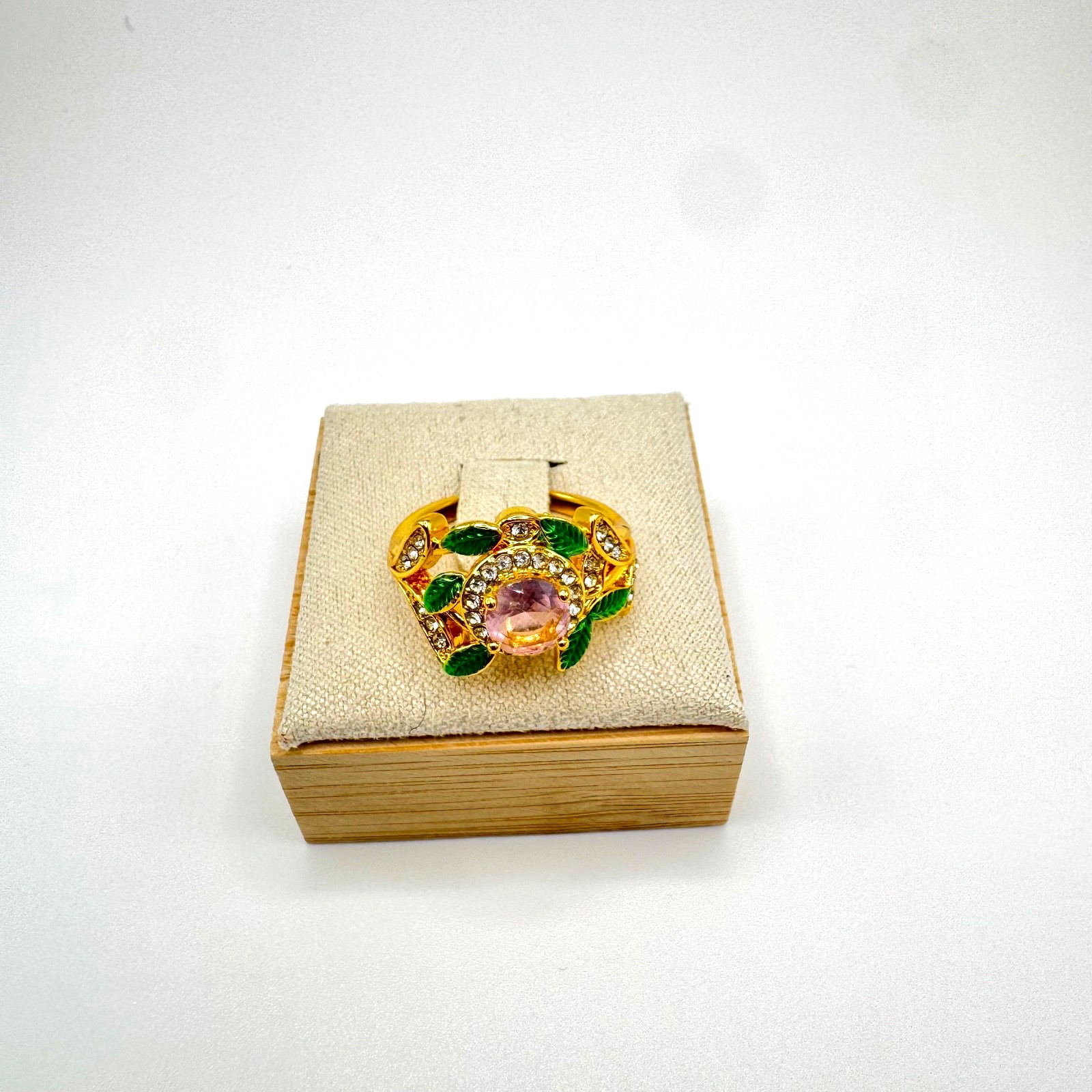Gold tone statement ring bundle with one central stone and ornate accent stones