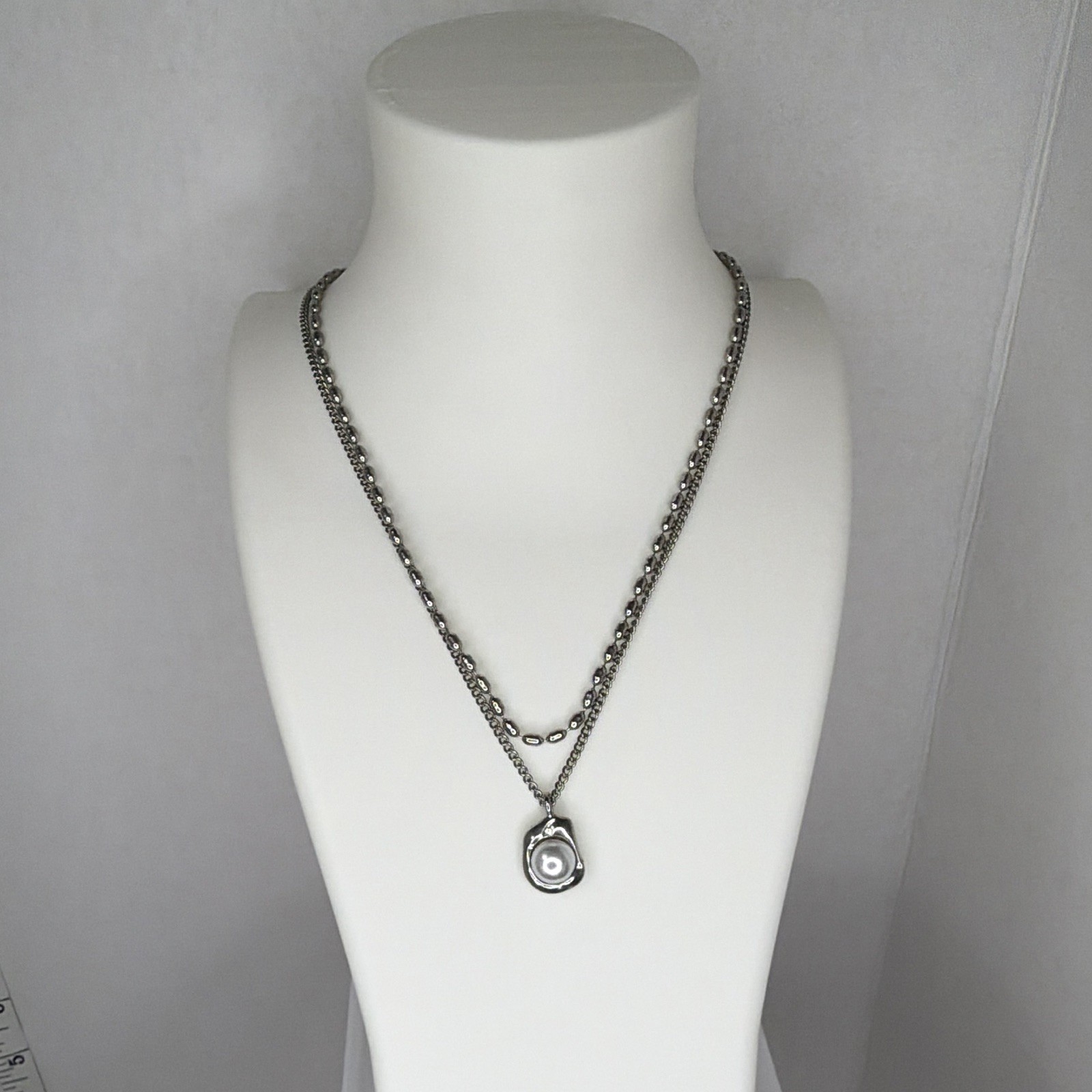 Double strand, gunmetal necklace with Central Pearl pending