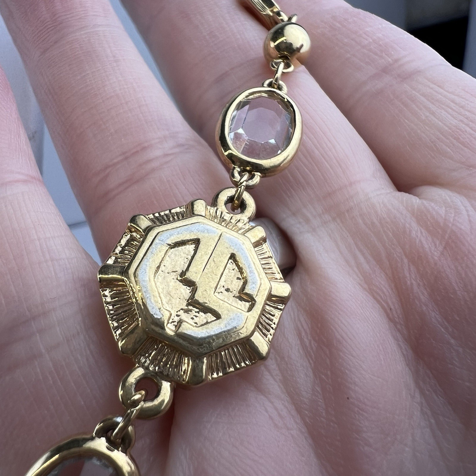 St. John Vintage 38″ Long Gold Tone Logo Necklace Clear Bezel Stations