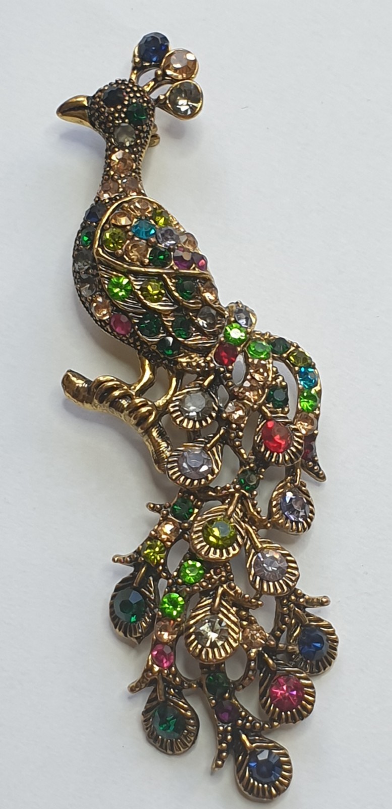 Peacock Brooch. Gold tone with Multicoloured glass beads . 84mm x 28mm.