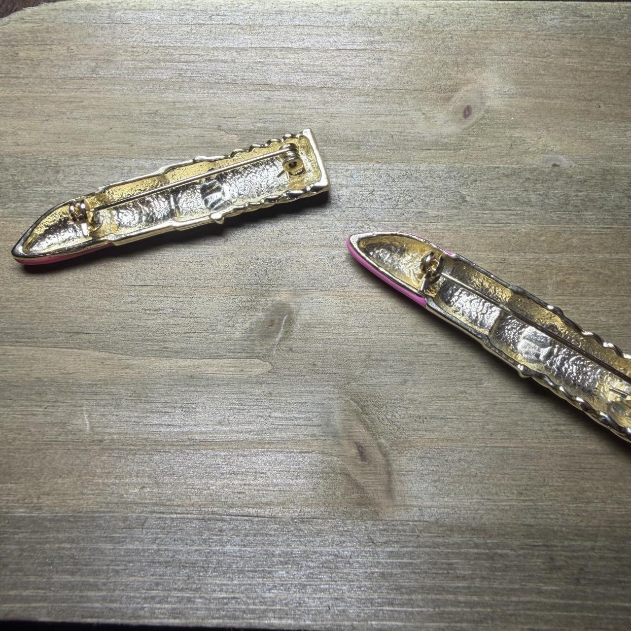 Pink lipstick shaped brooches with silver twisted metal design