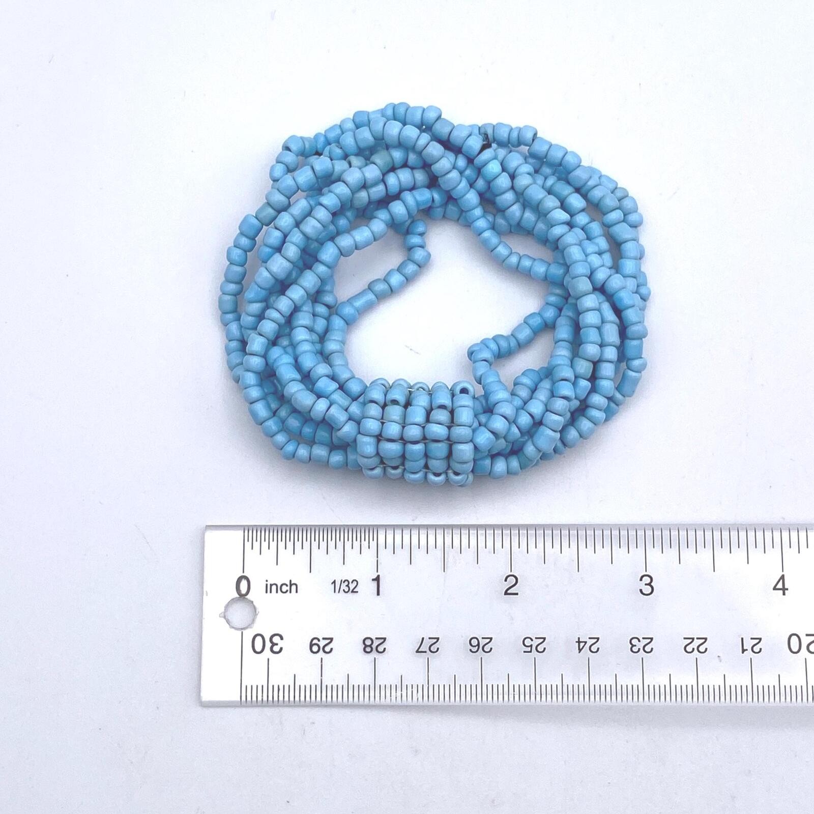 Vintage Blue Glass and Black Elastic Beaded 8 Strand 7 Inch Elastic Bracelet.