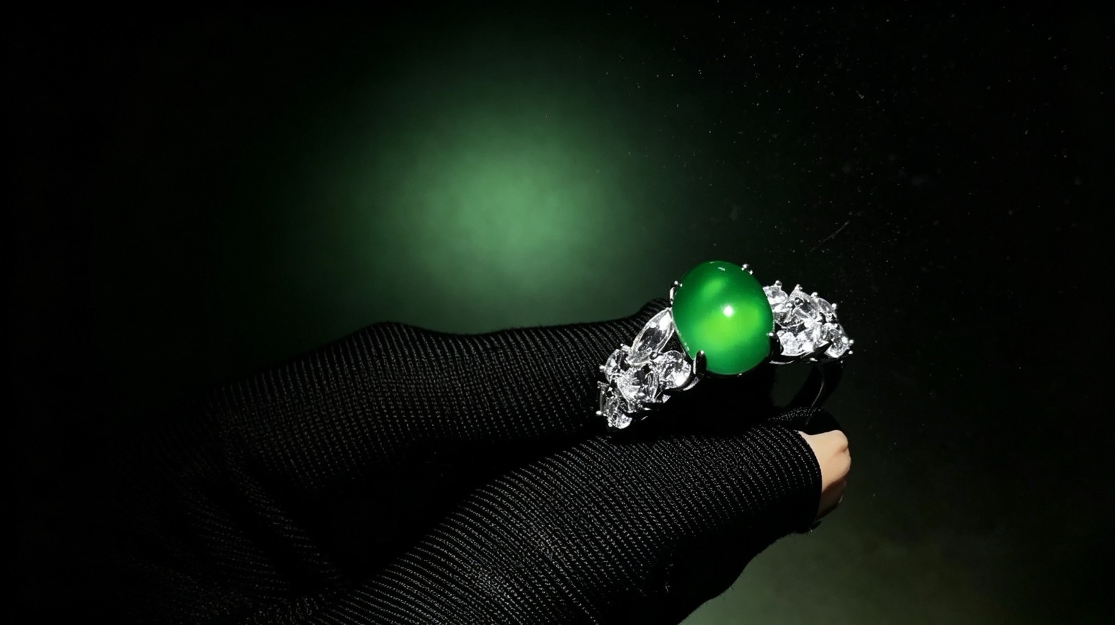 Oval emerald jadeite ring, side-set with zircons, adjustable opening