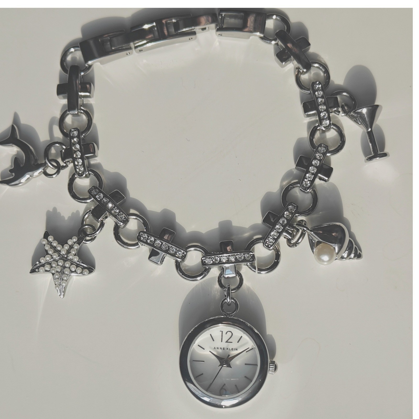 Anne Klein Silver Tone Beachy Charm Bracelet Watch Dolphin Starfish Seashell