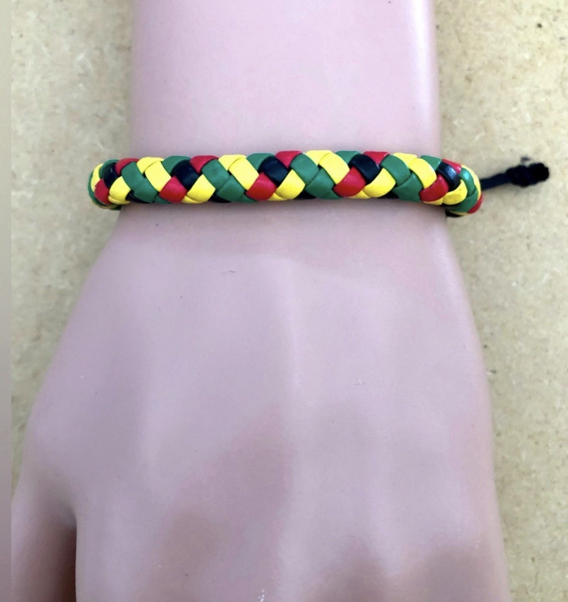multicolor braided cord bracelet . adjustable drawstring . slide closure