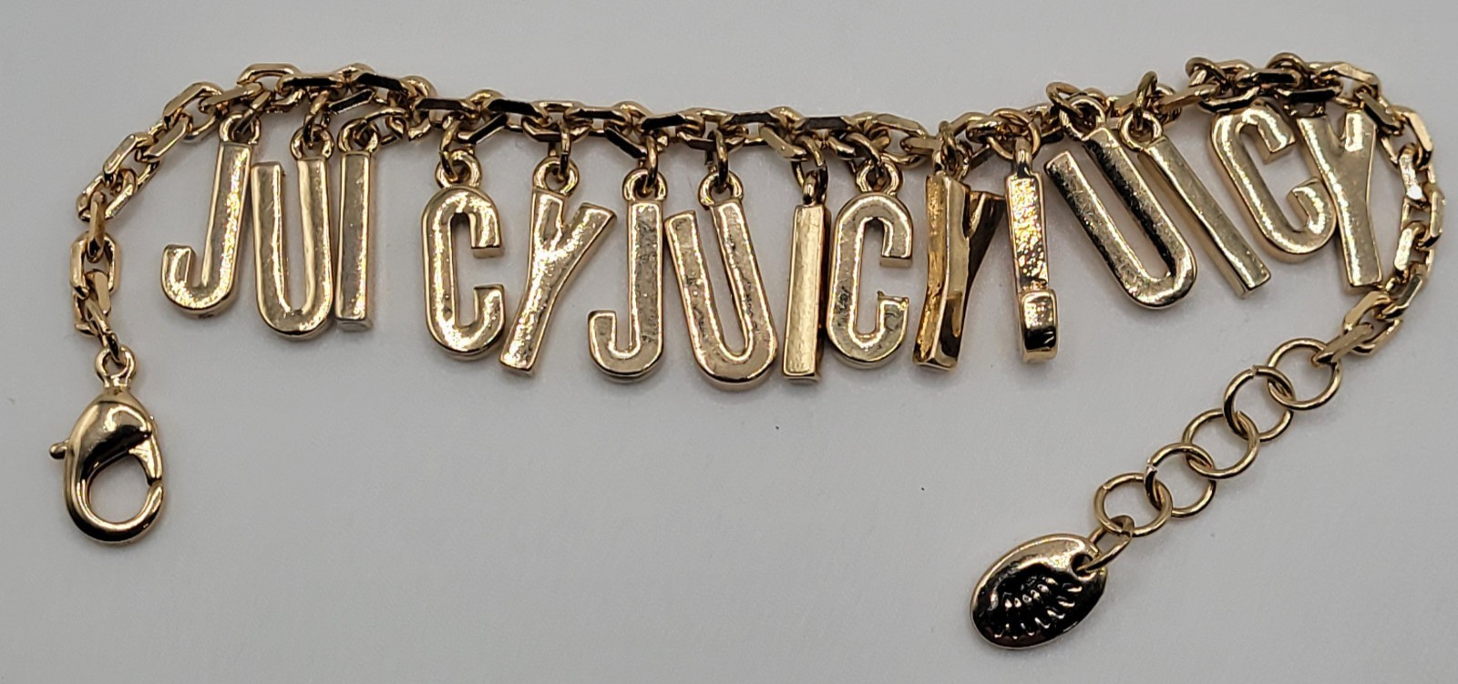 Juicy Couture Charm Bracelet Spelled Out JUICY Letters Gold Tone 6.5″ to 7″