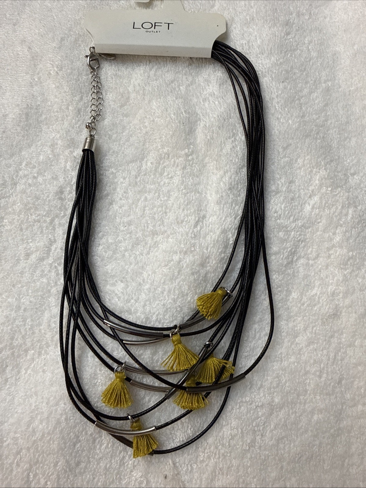 Loft Outlet Necklace. Black rolled, Silver accents, Yellow Tassles