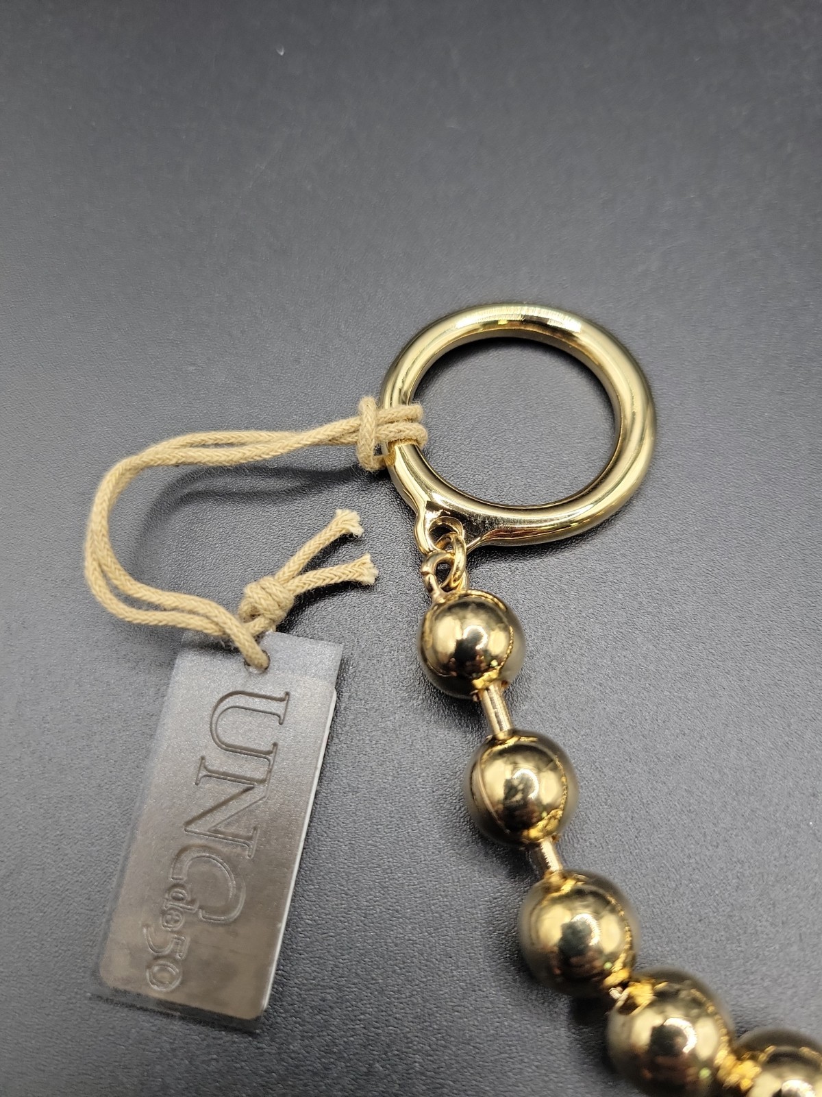 Uno De 50 Gold Tone Bead Ball On-Off Toggle Bar Bracelet Size M