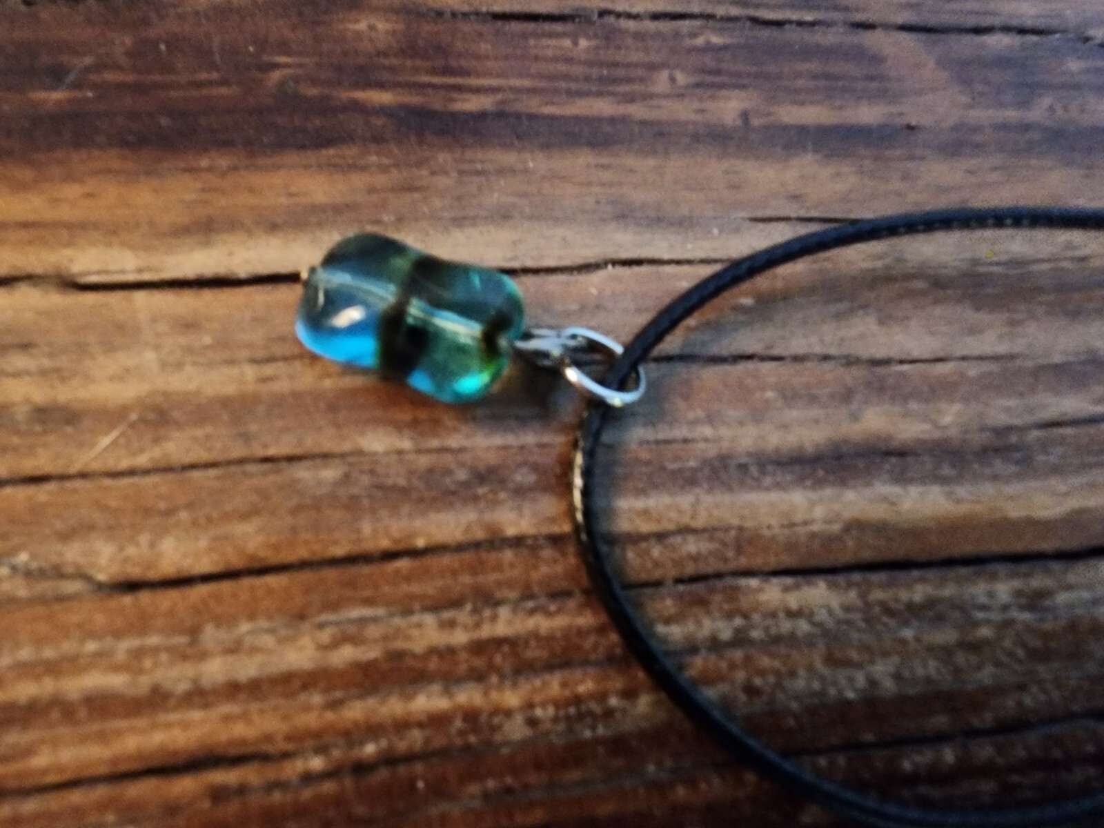 Handmade Black Corded Necklace with Clear Blue Glass Bead and black stripe