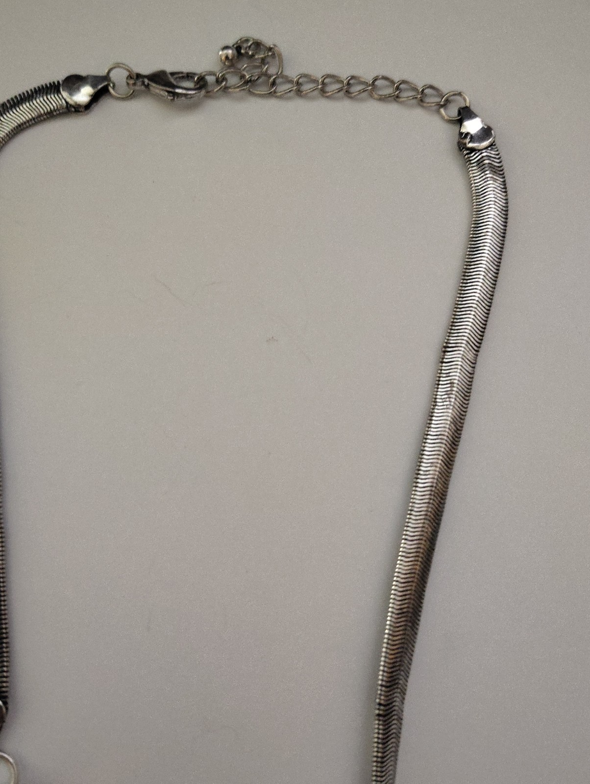 Beautiful silver/tone feather statement necklace