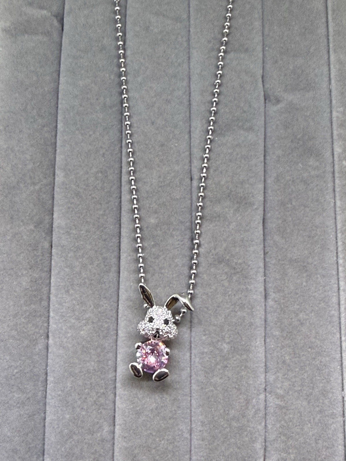 Child’s Rabbit Pend. With Pink. And Wht. Zircon And Stain. Steel Chain, 16 In