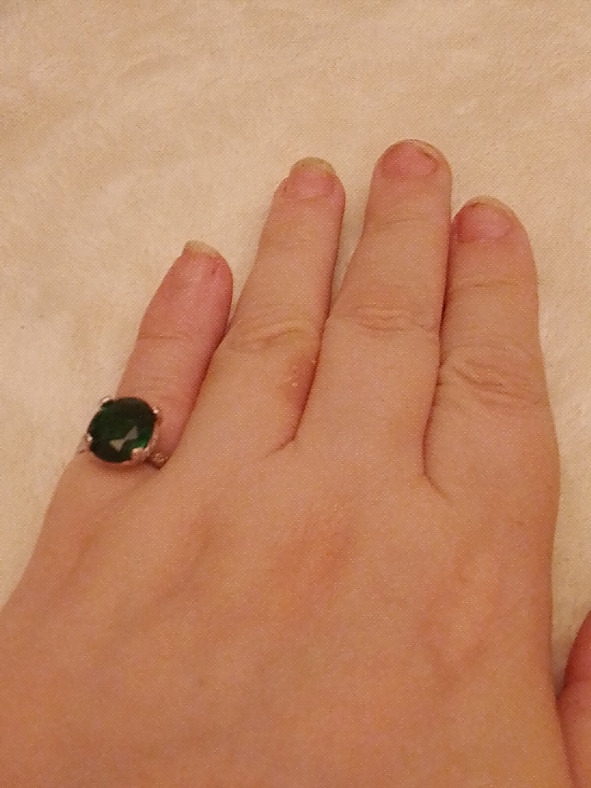 SizeUK J and USA 4.5 Possibly silver Green oval cut claw set ring