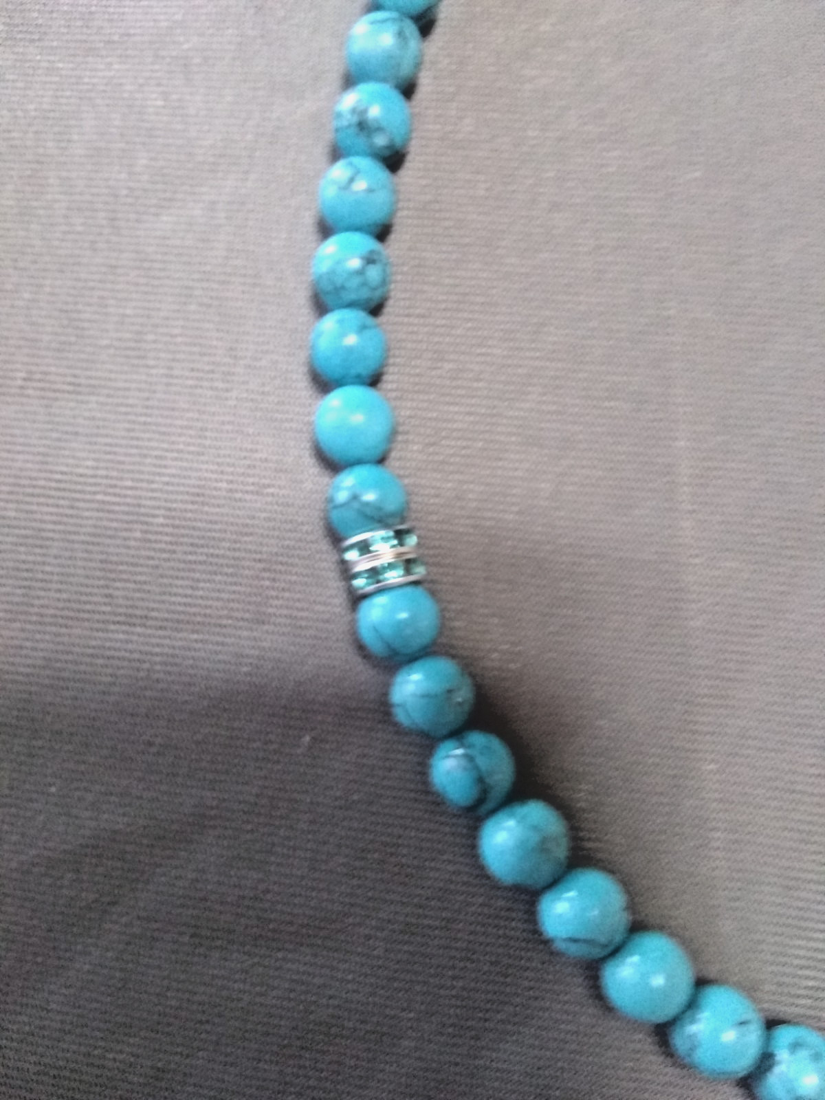 20″ necklace made of Turquenite beads and blue silver spacers with toggle clasp