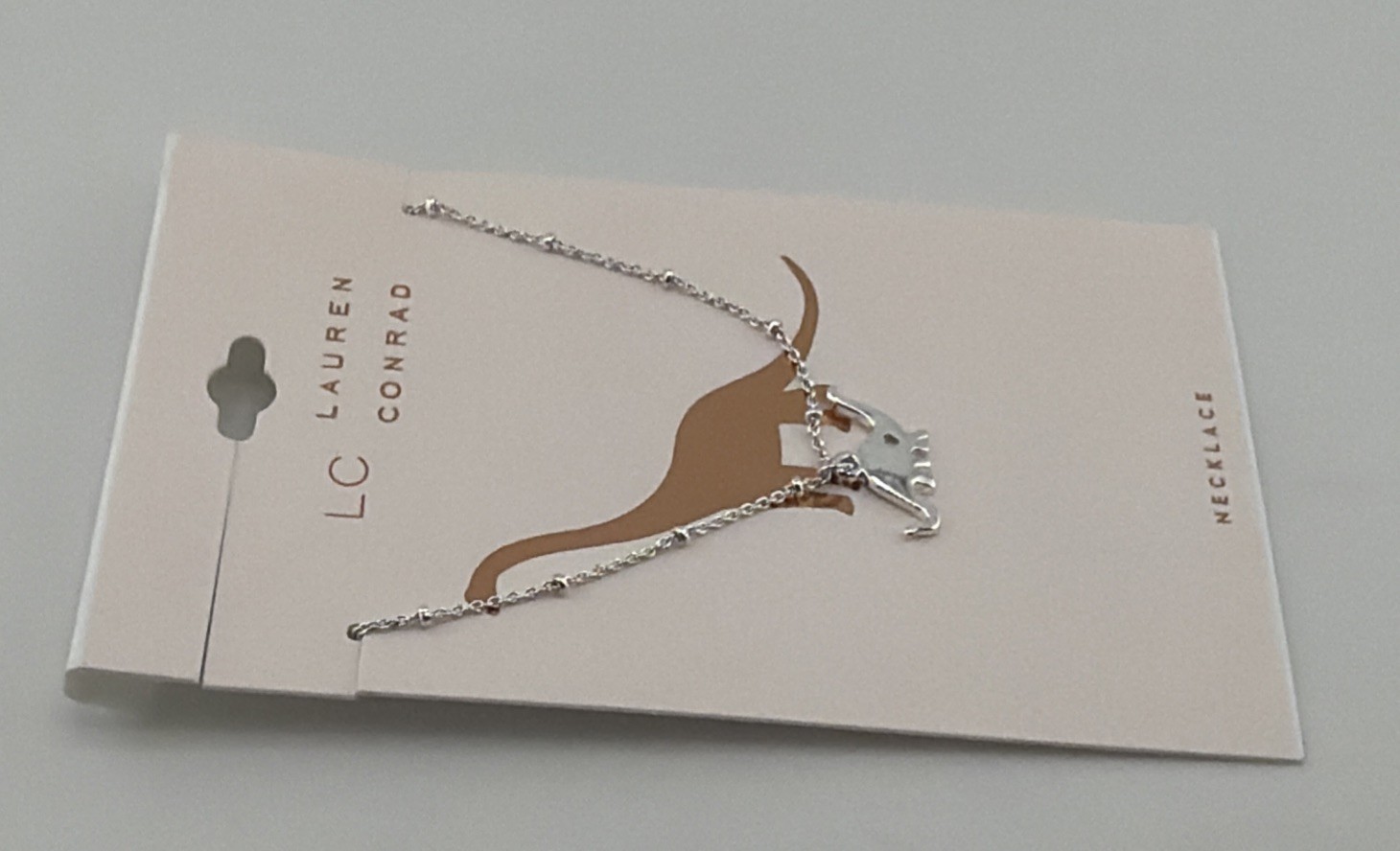 LC Lauren Conrad Dinosaur Pendant Necklace 16″ Silver Tone Prehistoric Charm.