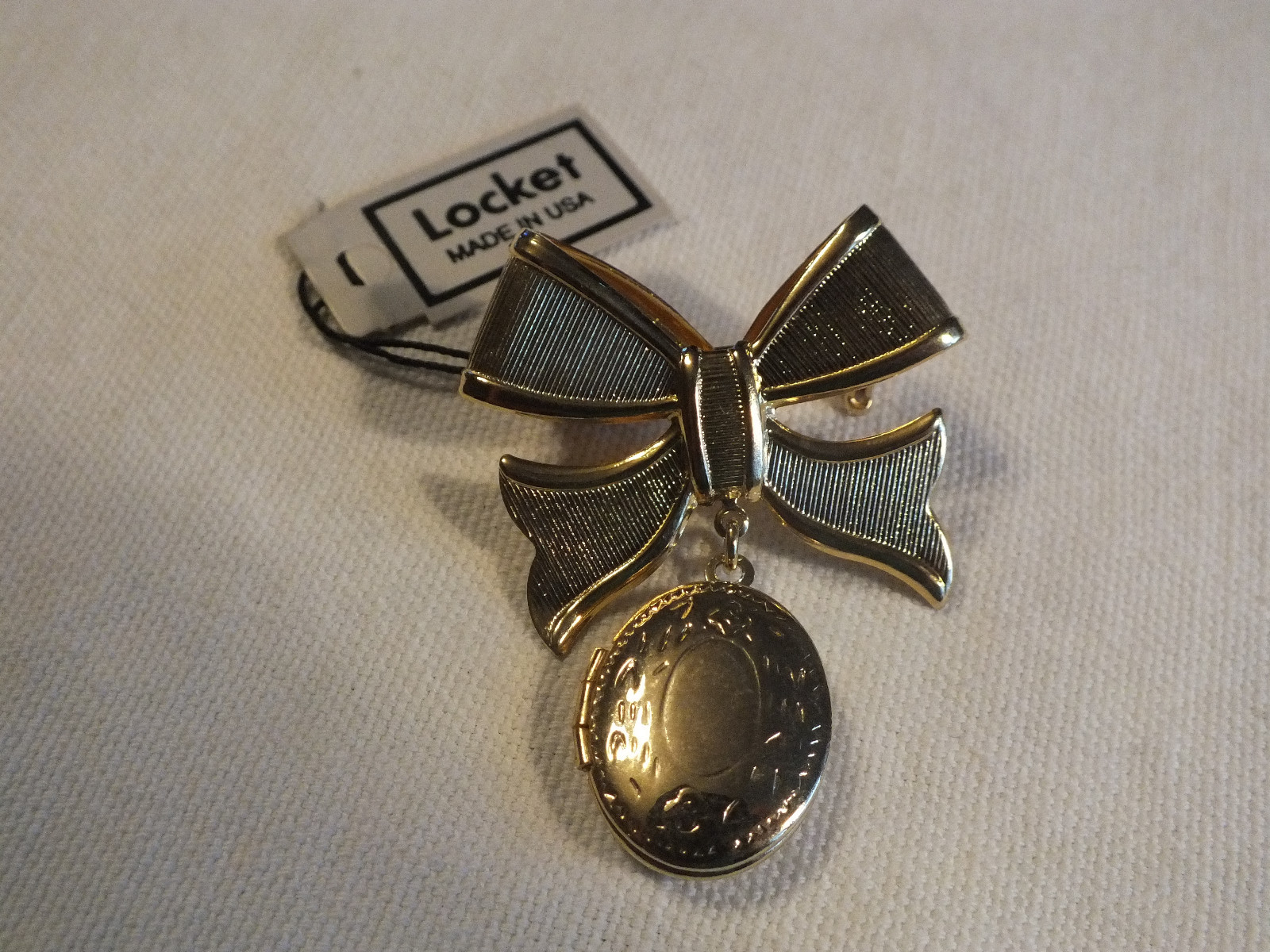 Beautiful Locket Brooch Embossed Gold Tone Original Tag Made in USA 1 7/8 x1 1/2