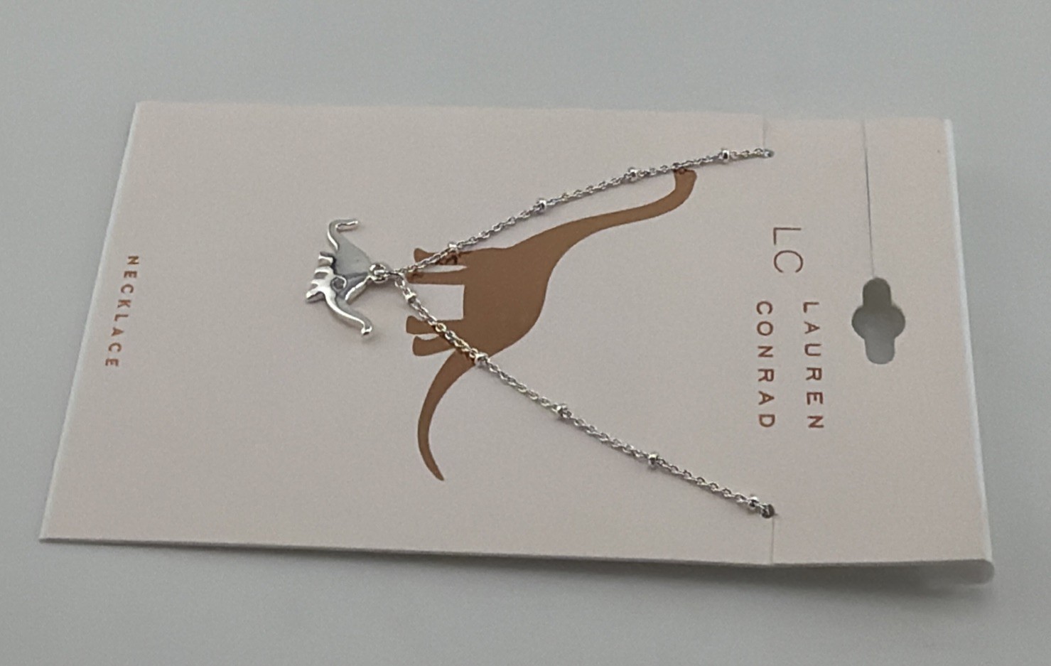 LC Lauren Conrad Dinosaur Pendant Necklace 16″ Silver Tone Prehistoric Charm.