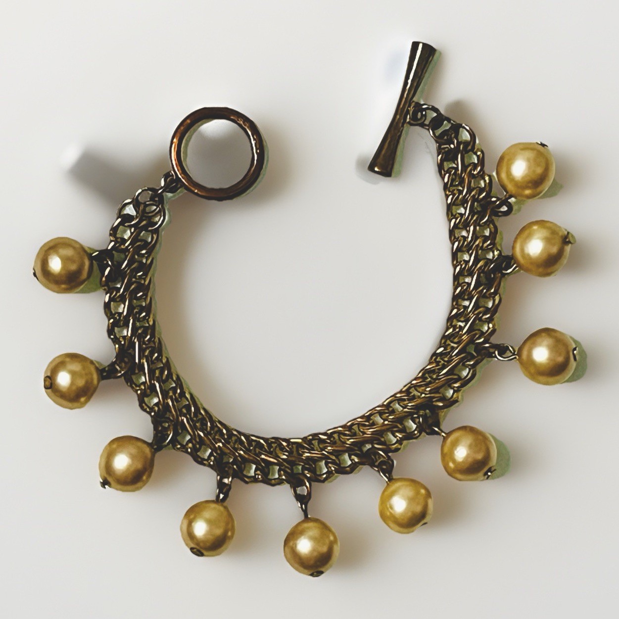 Vintage AVON Goldtone Bracelet Champagne Faux Pearl Dangle with Toggle Clasp 7″