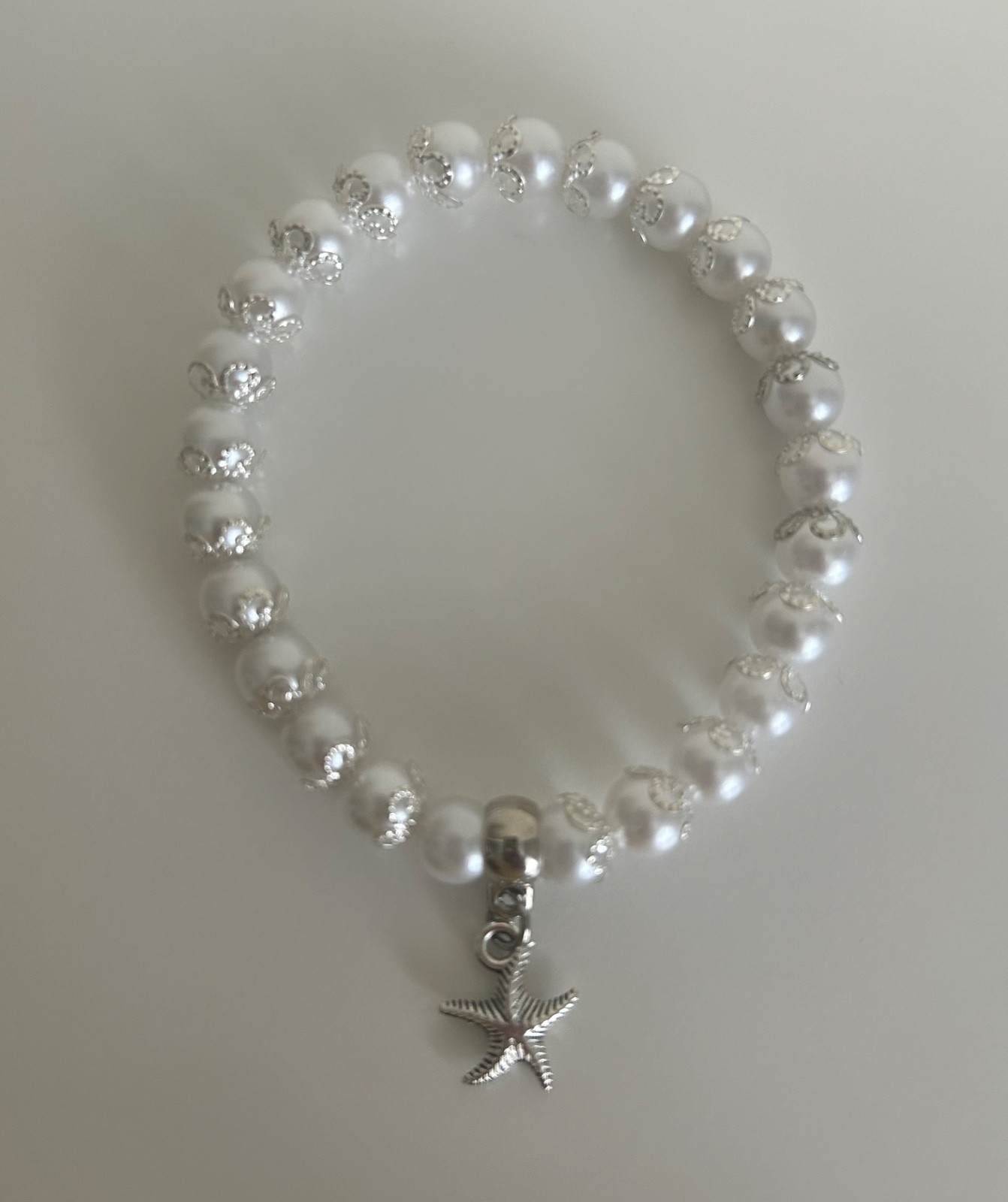 Ladies White pearl bracelet with silver covered detail and jellyfish charm S/M